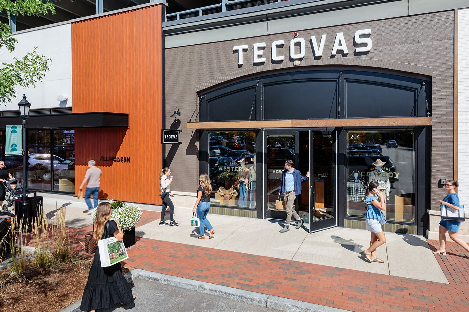 ARCHITECTURE PHOTOGRAPH OF A RETAIL MALL IN BOSTON NEW ENGLAND SHOWING PEOPLE COMING AND GOING FOR A SHOP TAKEN FROM ELEVATED POSTION