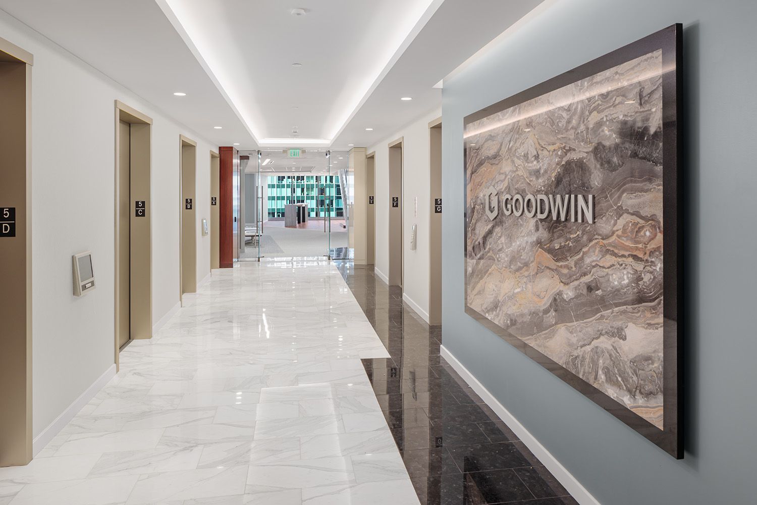 THE FOYER OF A NEW ENGLAND BASED LAW FIRM SHOWING THE ELEVATOR ACCESS AND THE ENTRANCE TO THE MAIN OFFICE SPACE