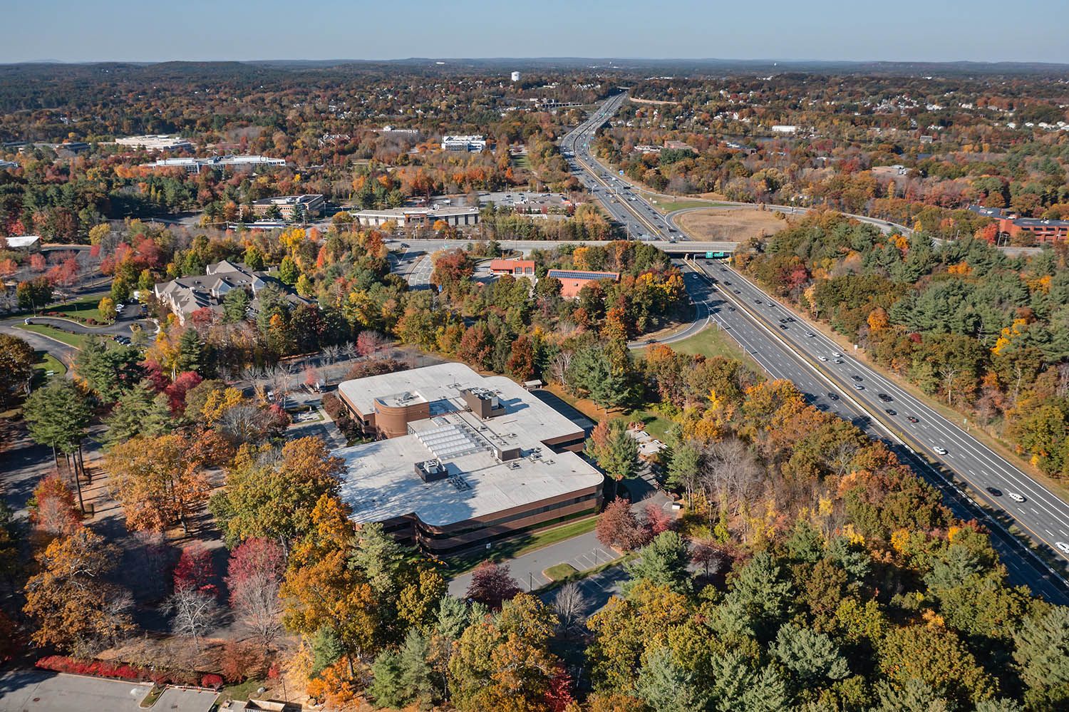 Architectural Drone image showing office building and transport links in NH