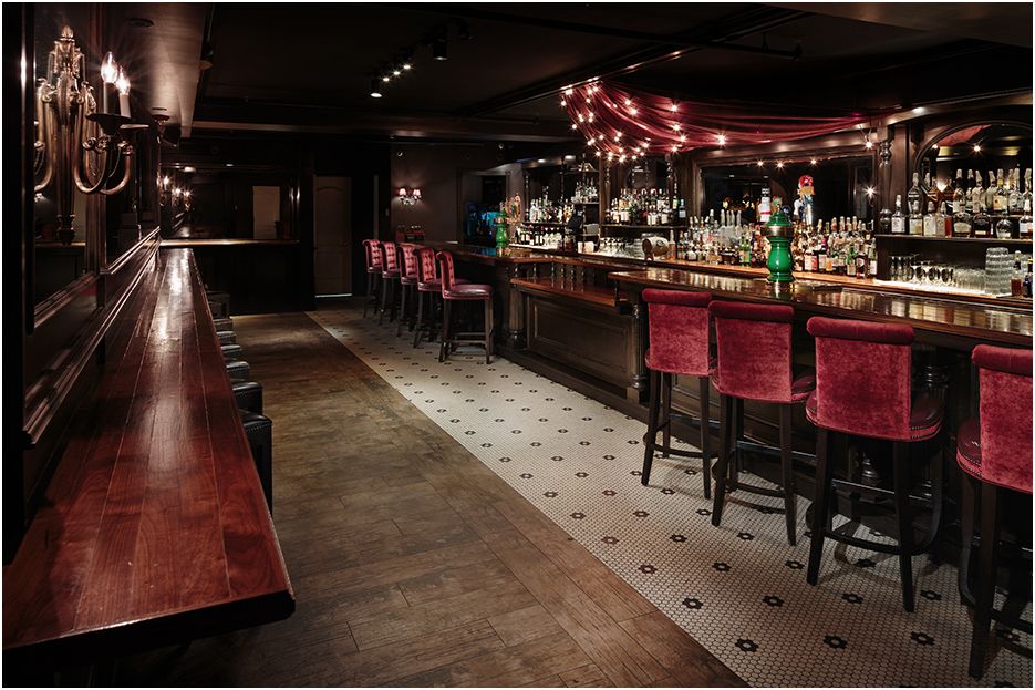 Architectural restaurant and bar photography of Carrie Nation in downtown Boston MA showing  the main bar space and service area.