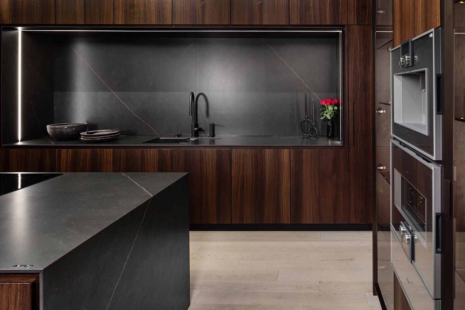 Architectural image taken for Boston area kitchen design company of showroom featuring their dark kitchen angle number 1