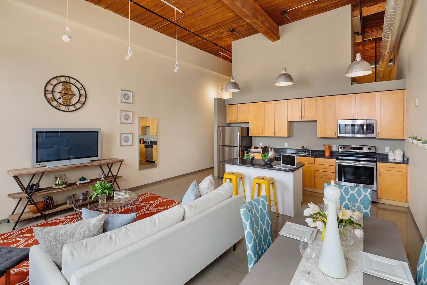 Interior architectural image showing residential kitchen and living room area in Boston condominium