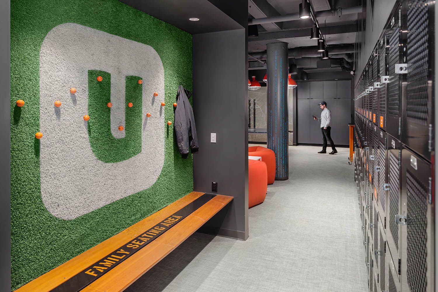 Downtown office renovation photo of corporate business location for architectural firm showing lockers for staff and artwork on wall