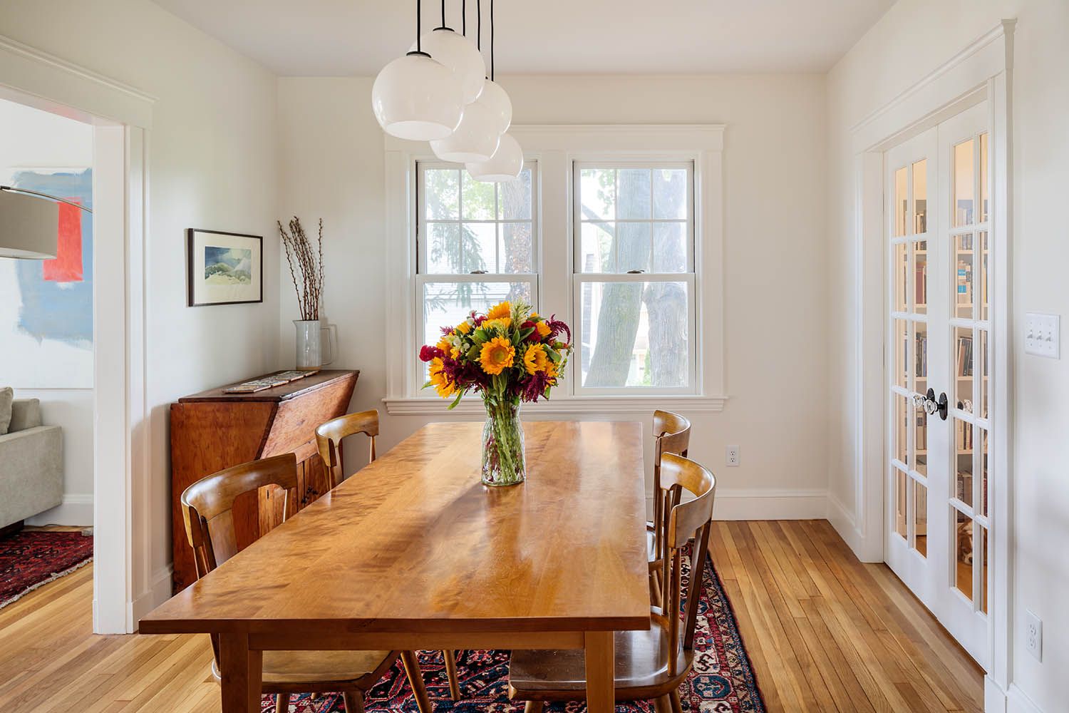 Residential architectural images taken Boston area architects showing interior dining space and connection to living room and side office