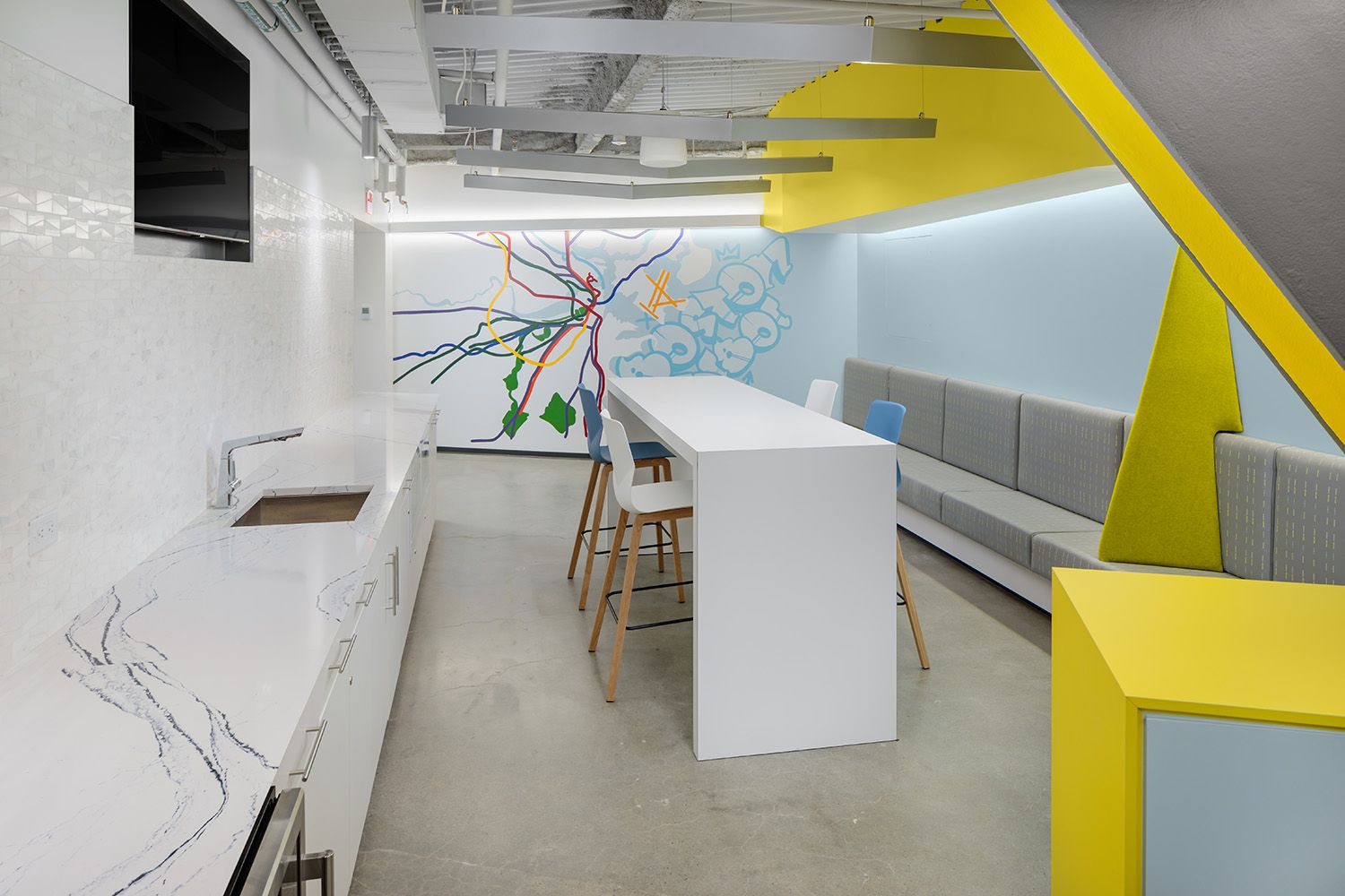 A BRIGHT AND SPACIOUS BREAK OUT AND EATING AREA IN A NEWLY INSTALLED OFFICE SPACE IN BOSTON MA