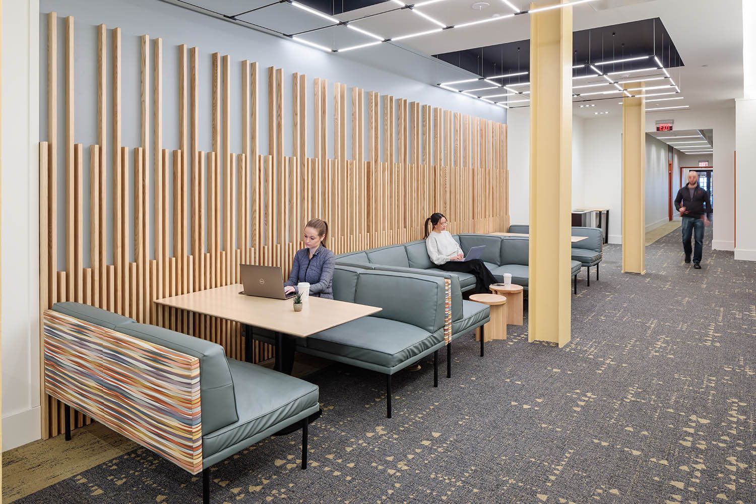 Boston College photography for local architects showing common areas on the ground floor with seating and elevator access.