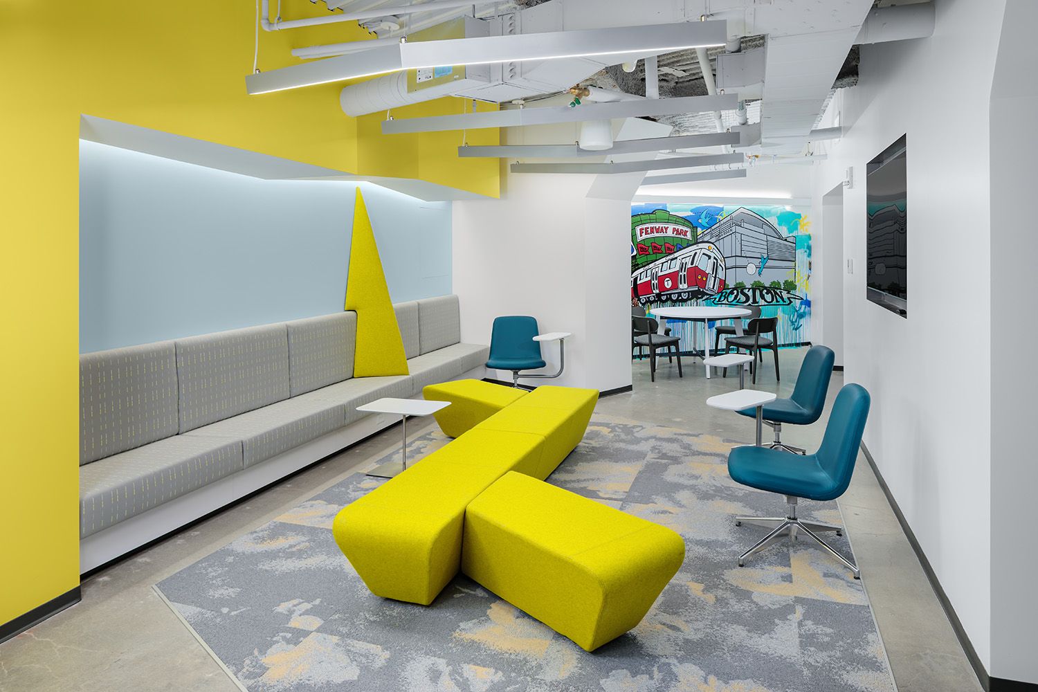 A BEAUTIFUL INTERIOR SPACE FEATURING COLORFUL FURNITURE FOR THE BOSTON COMPANY THAT DESIGNED AND INSTALLED IT