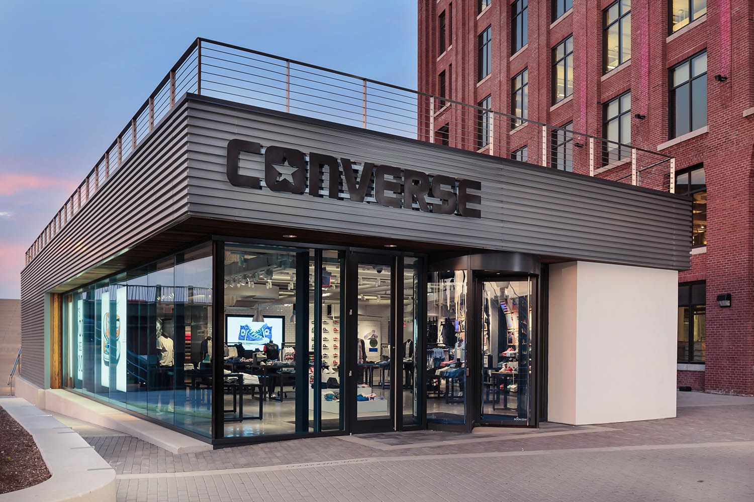 Converse Boston HQ exterior architectural office space photography showing retail store onsite close up at dusk to show the design details