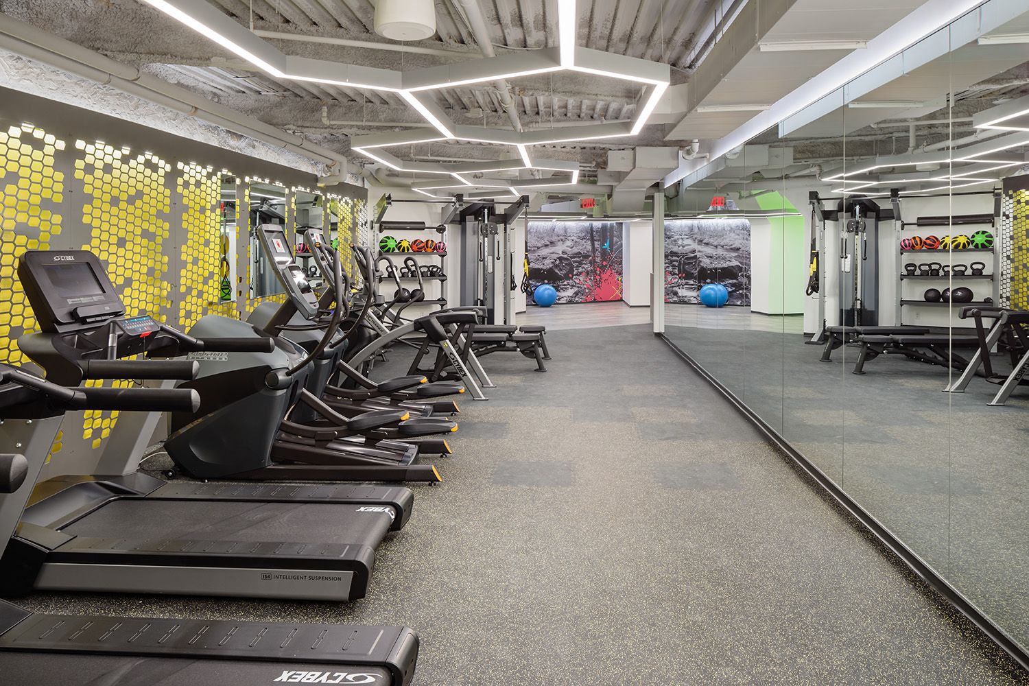A NEWLY CONSTRUCTED GYM SPACE IN A COMMERCIAL PROPERTY IN BOSTON THAT IS USED BY THE TENANTS AND WORKERS WITHIN THE BUILDING