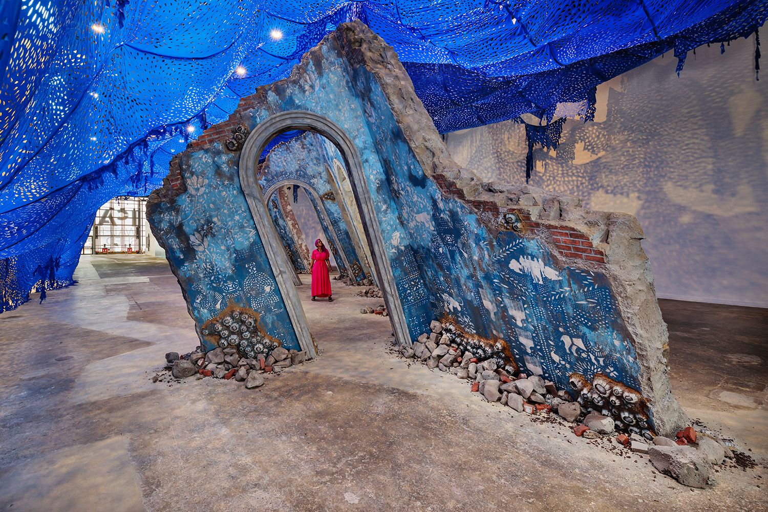 SINGLE PERSON FEATURED IN THIS ARCHITECTURAL PHOTO OF ARTISTS WORK INSTALLED IN GALLERY IN BOSTON MA