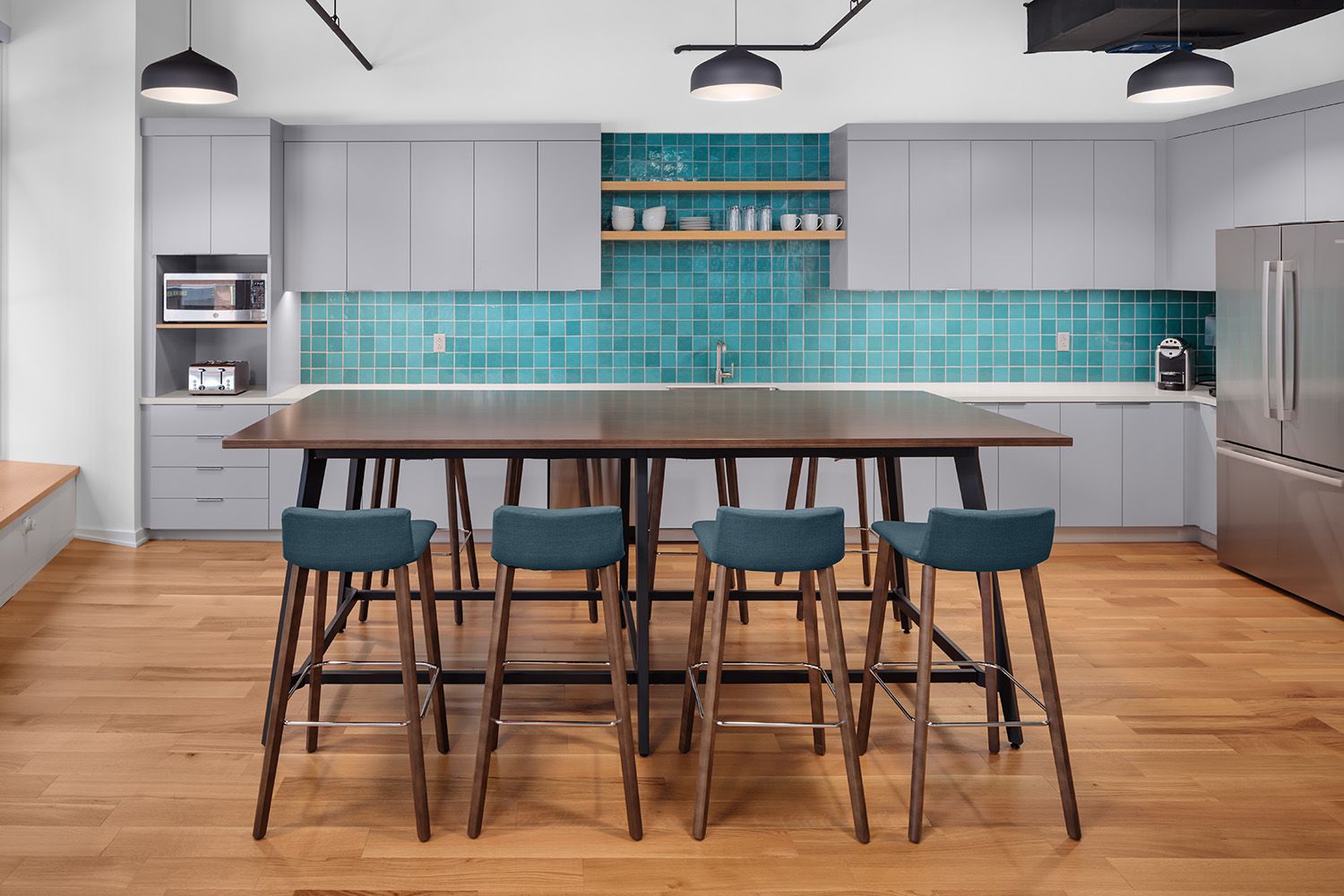 A NEWLY DESIGNED AND INSTALLED KITCHEN AND DINING AREA SITUATED IN A RENOVATED BOSTON LAW FIRM