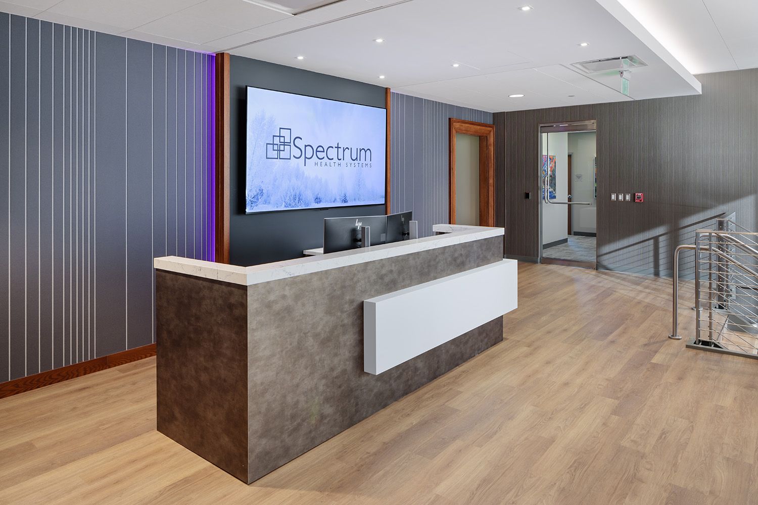 THE RECEPTION DESK AREA OF A NEWLY OPEN HEALTHCARE CORPORATE OFFICE SPACE IN WESTBOROUGH MA