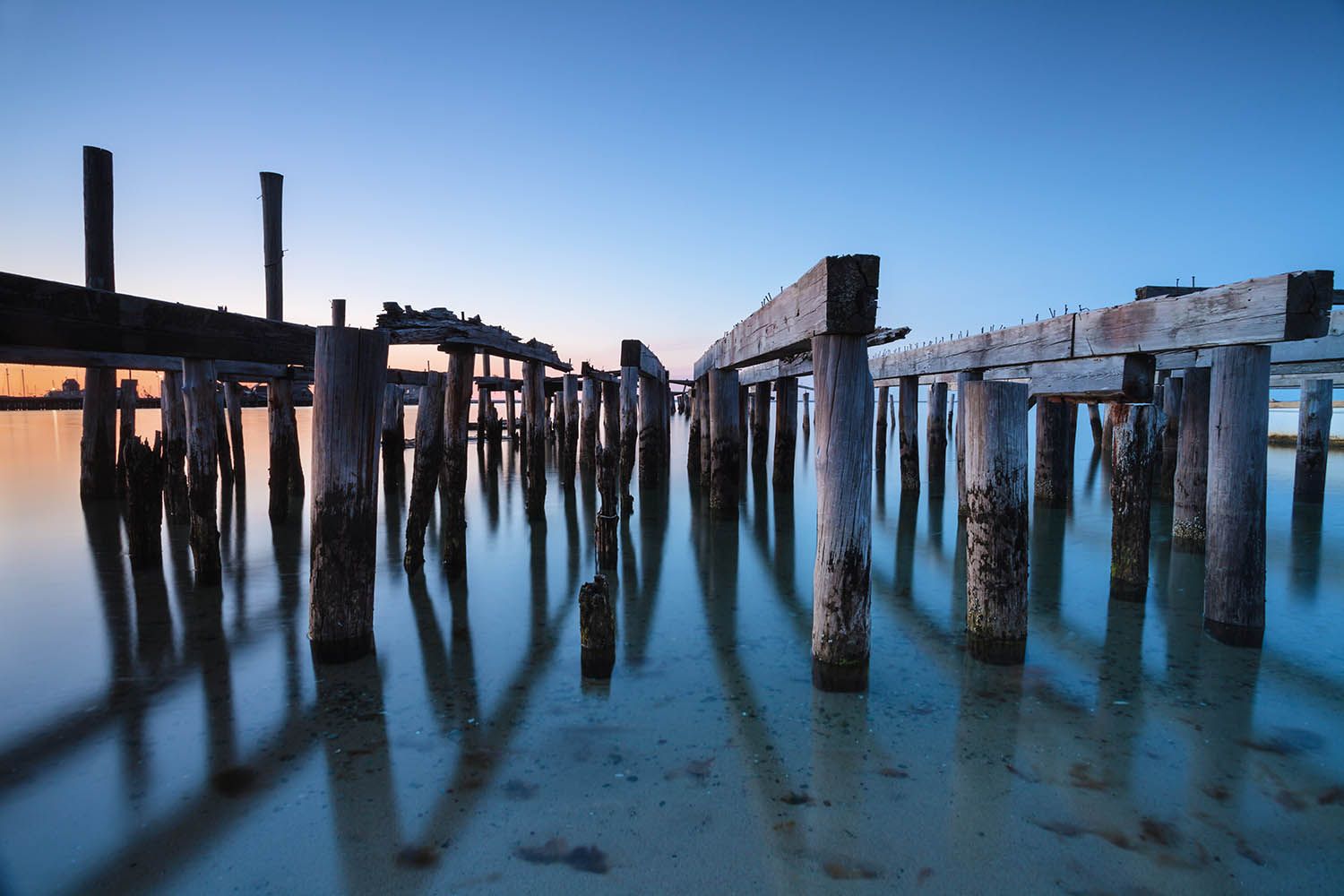 Color landscape photograph showing old dock no longer used in Provincetown on Cape Cod near Boston MA