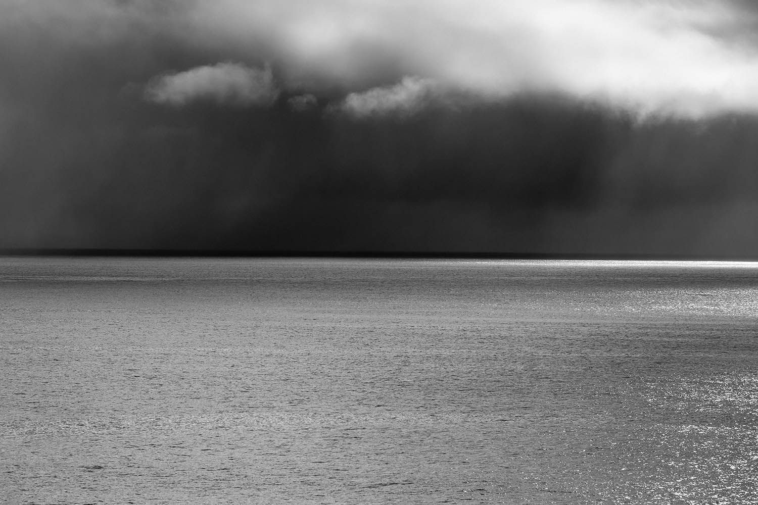 BLACK AND WHITE LANDSCAPE PHOTOGRAPH FROM THE COAST OF ISLAND IN THE AZORES PORTUGAL