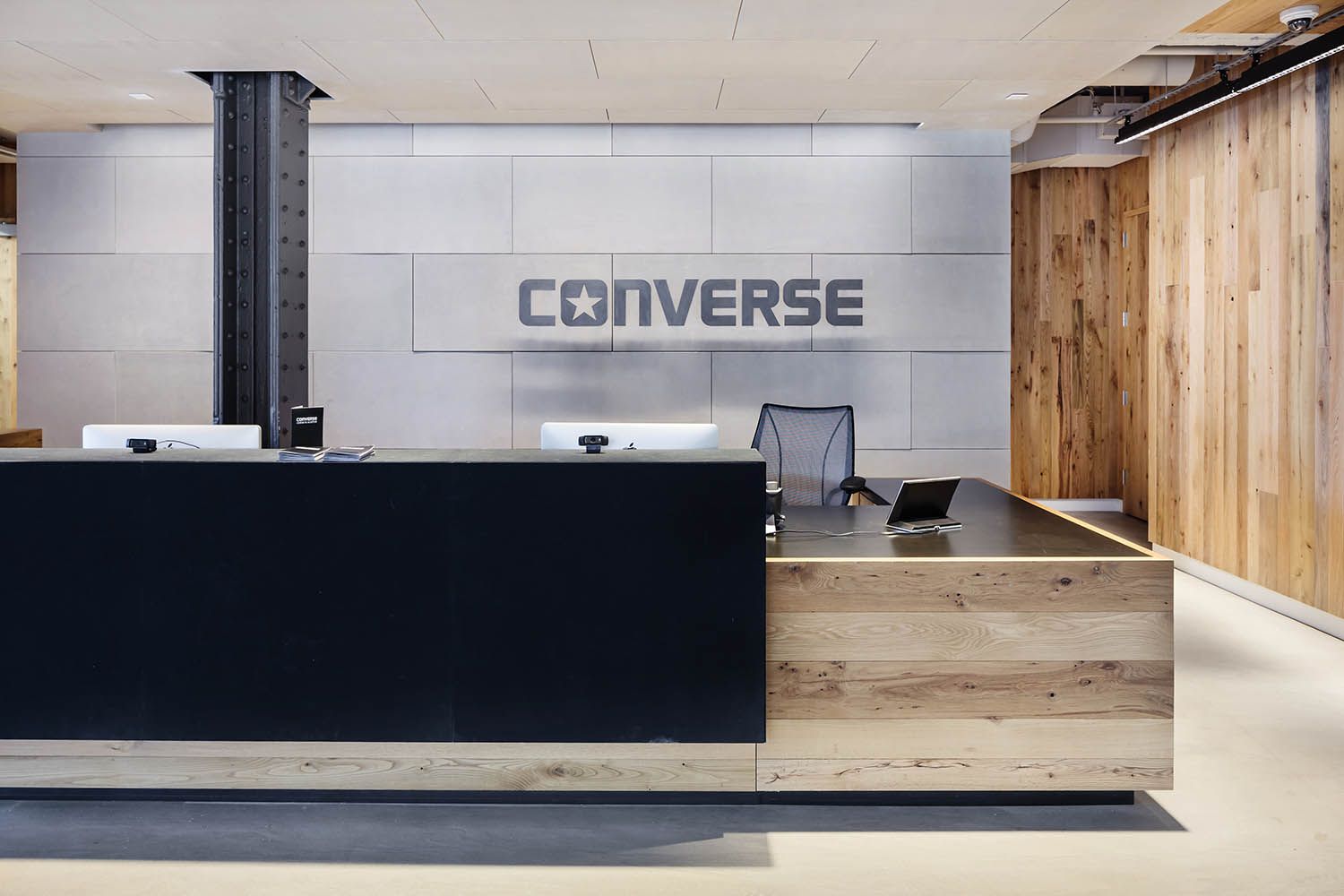 Converse Boston HQ interior architectural office space photography showing the main reception desk for the buiding
