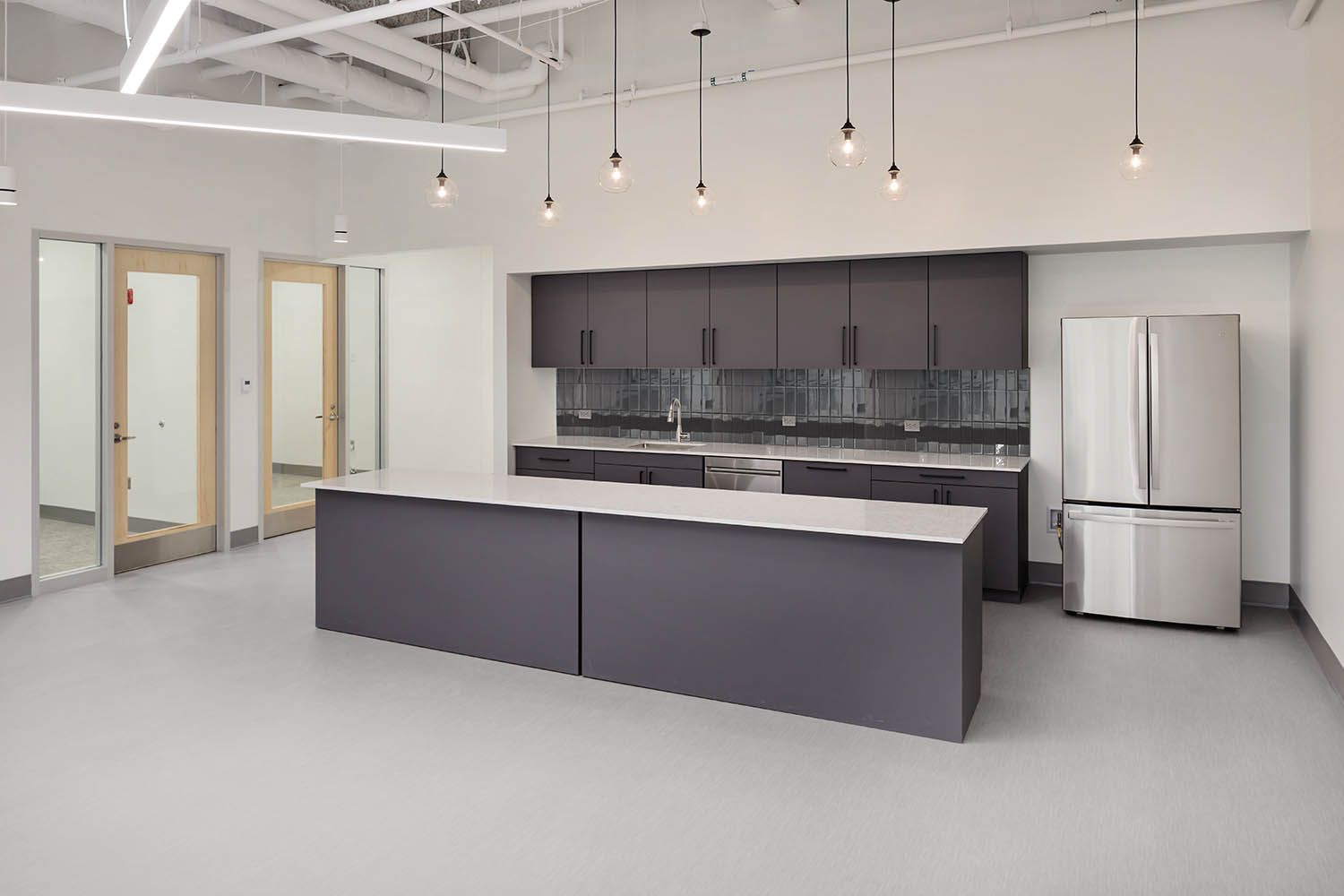 New life sciences building in Medford MA architectural photography of kitchen and meeting room space for Boston building developers