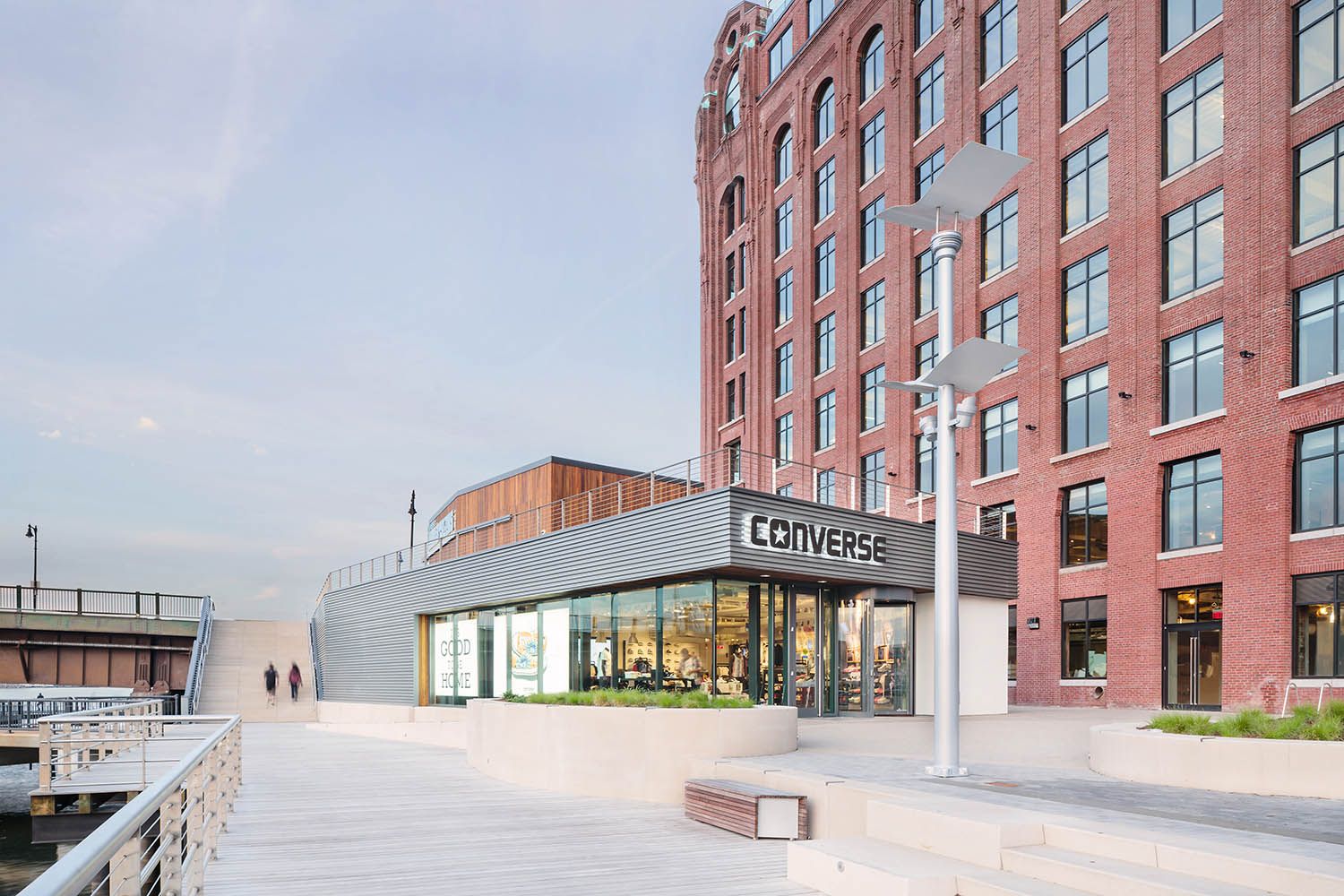 Converse Boston HQ exterior architectural office space photography showing retail store onsite and access to the bridge and street behind