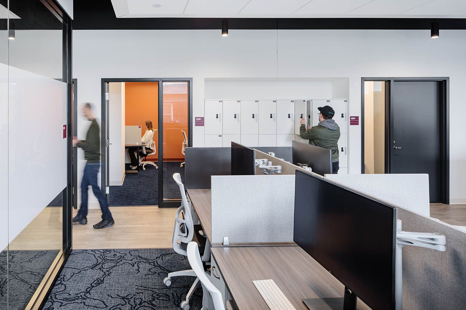 Boston office photography for Bergmeyer architects showing desk setup and side study rooms in New England college space