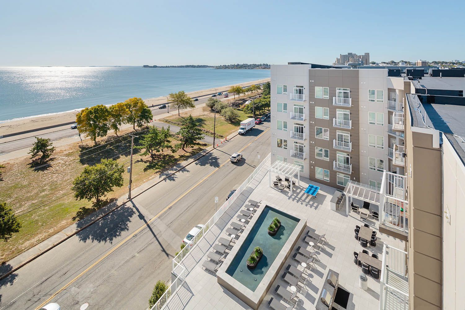 Architectural image taken for Boston area real estate agent showing residential exterior common areas, fire pits view along the coastline