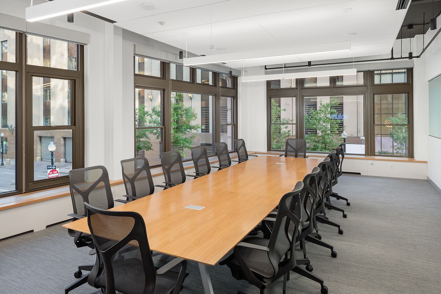A LARGE BOARDROOM PHOTOGRAPH TAKEN IN A NEWLY DESIGNED BOSTON OFFICE LOCATION FOR THE BUILDING COMPANY THAT COMPLETED THE INSTALL
