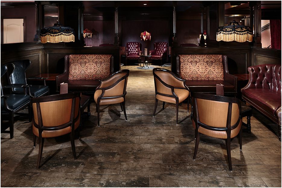 Architectural restaurant and bar photography of Carrie Nation in downtown Boston MA showing  the main seating area within the bar.