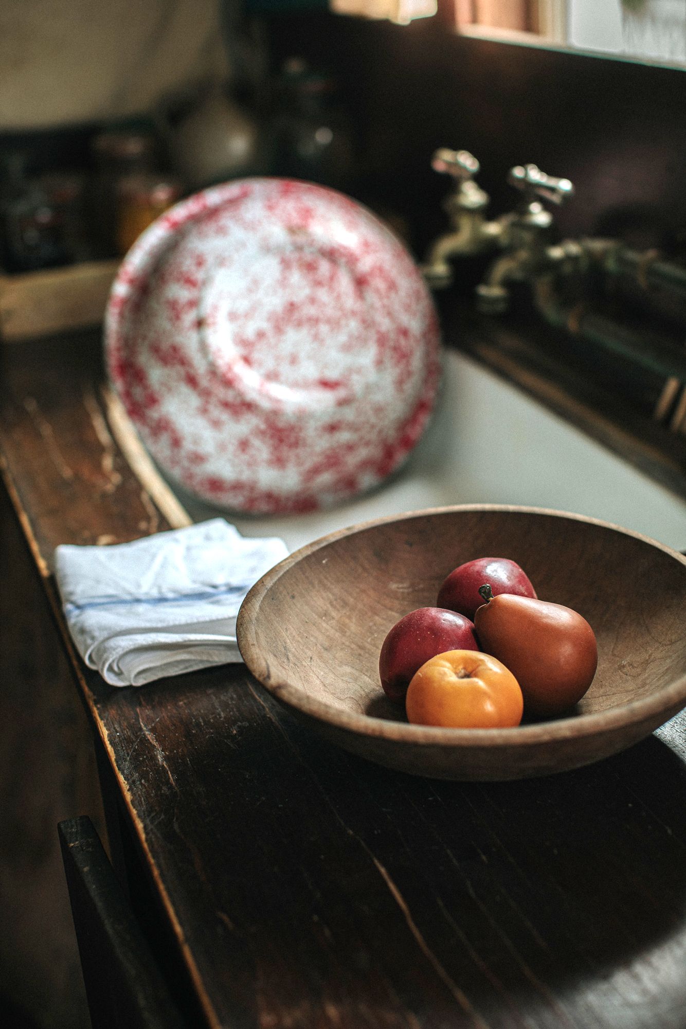 Vintage kitchen of wooden bowl with fruit and vintage wash bowl at Strawberry Bank Portsmouth New Hampshire. New England photographer