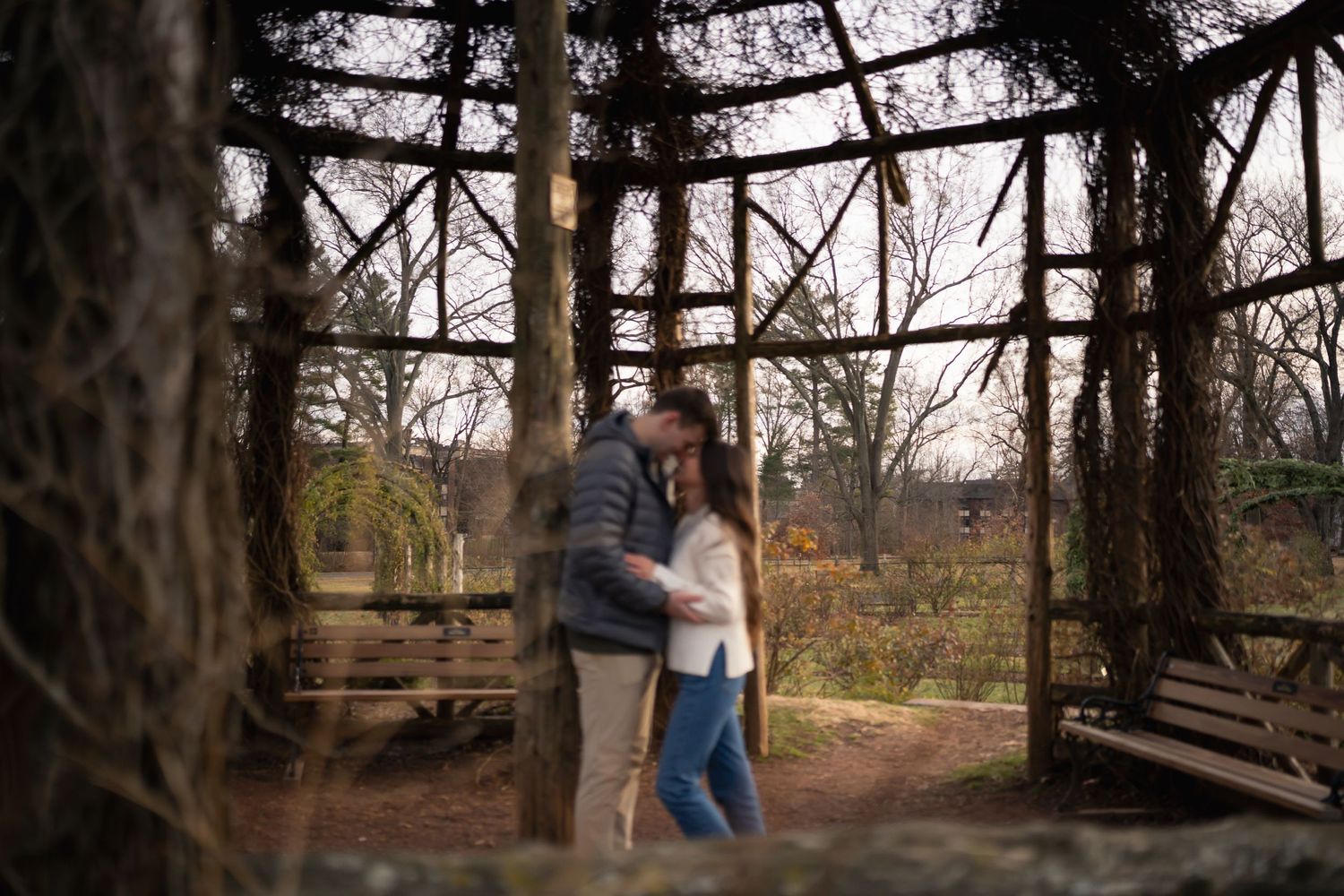 winter engagements photo session in elizabeth park photos of couple walking in hut
