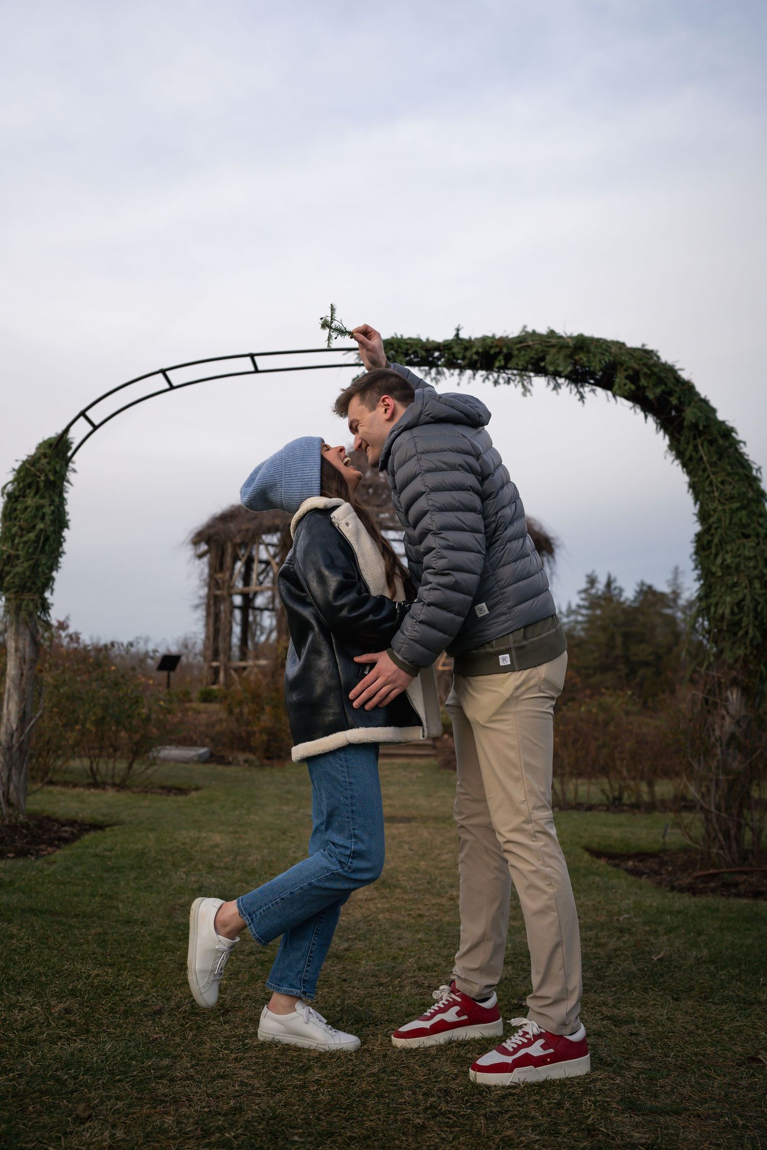 winter engagements photo session in elizabeth park photos of couple mistletoe