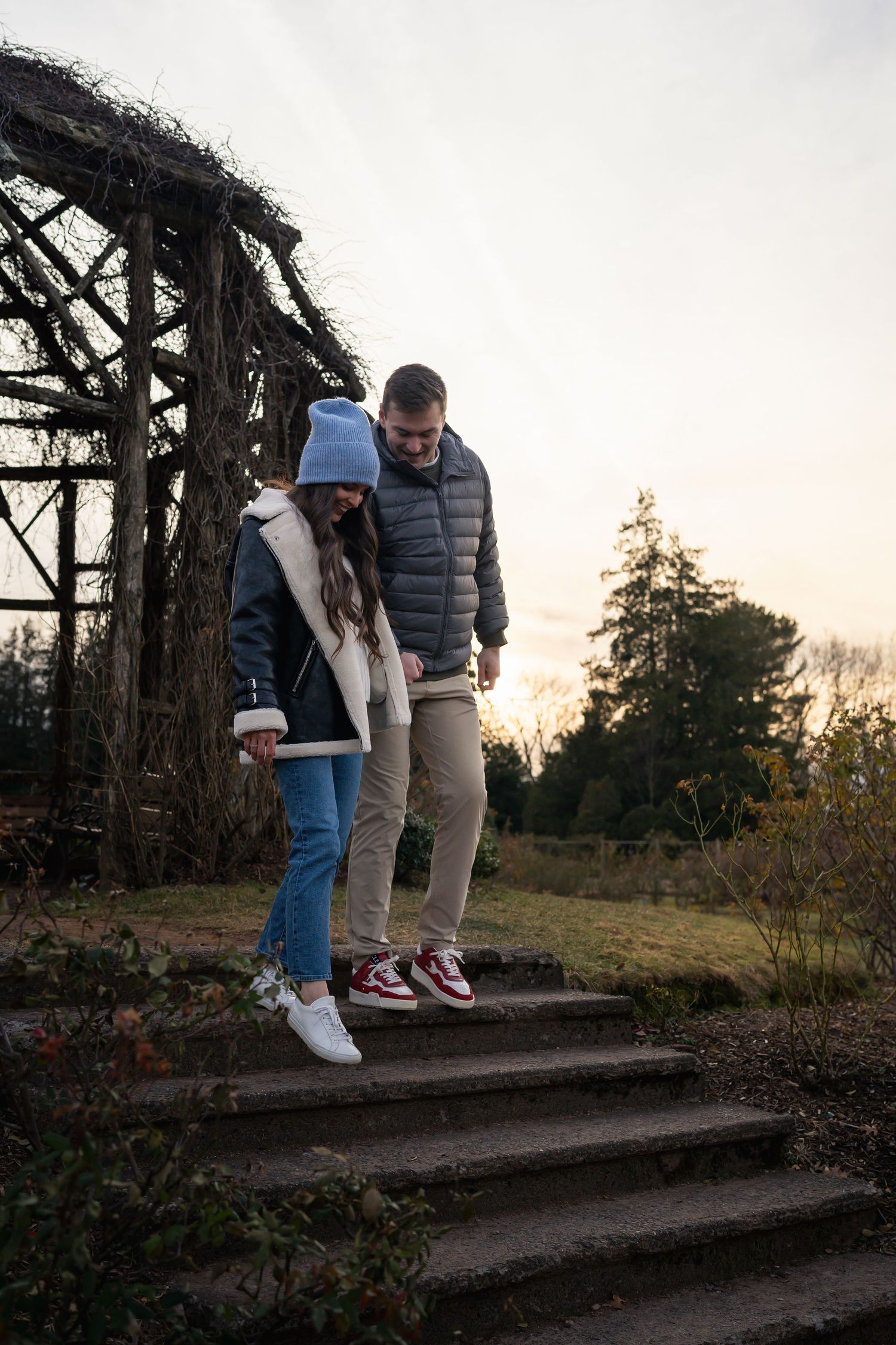 winter engagements photo session in elizabeth park photos of couple walking down steps