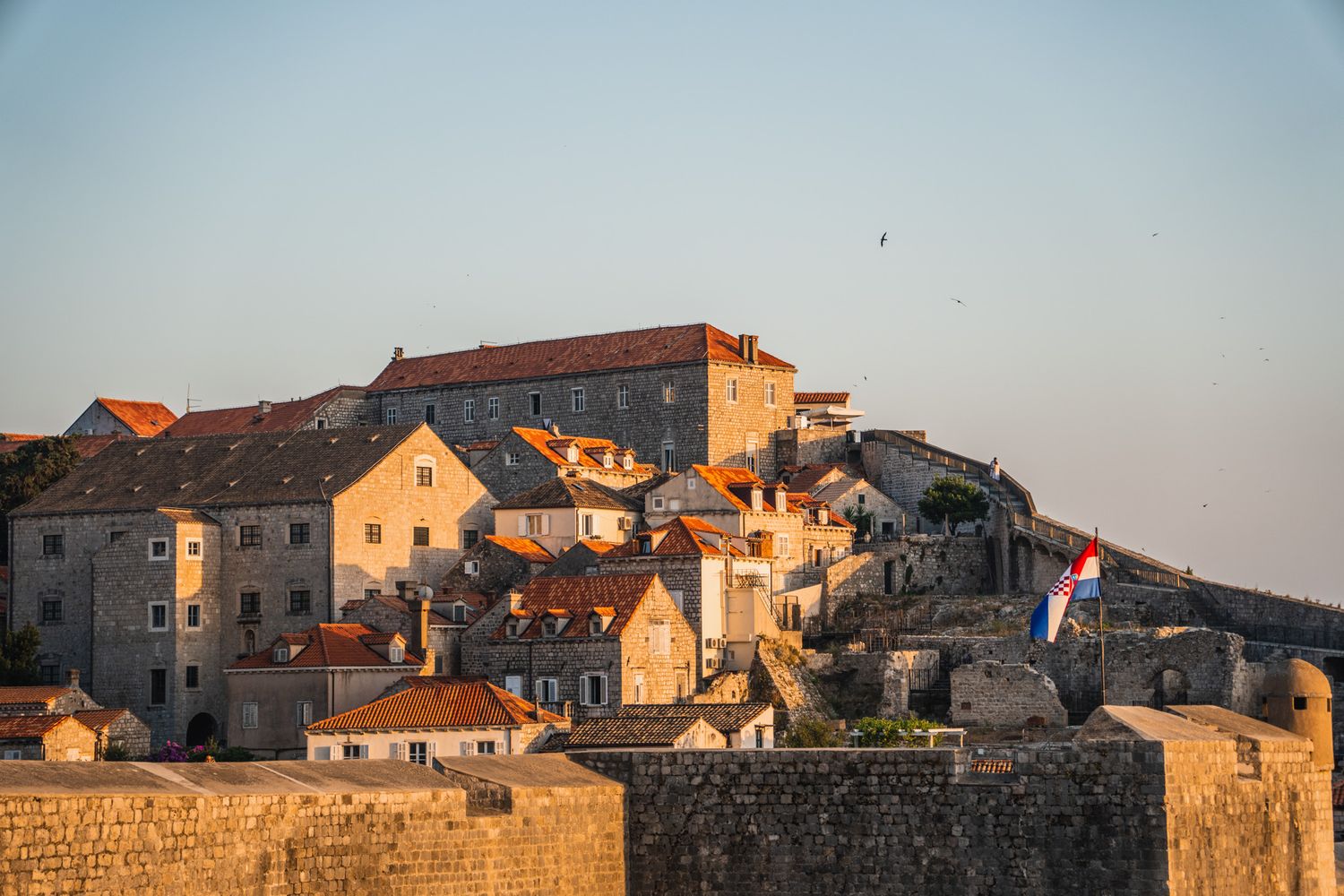 travel photo of sunset along dubrovnik, croatia old town fortress wall