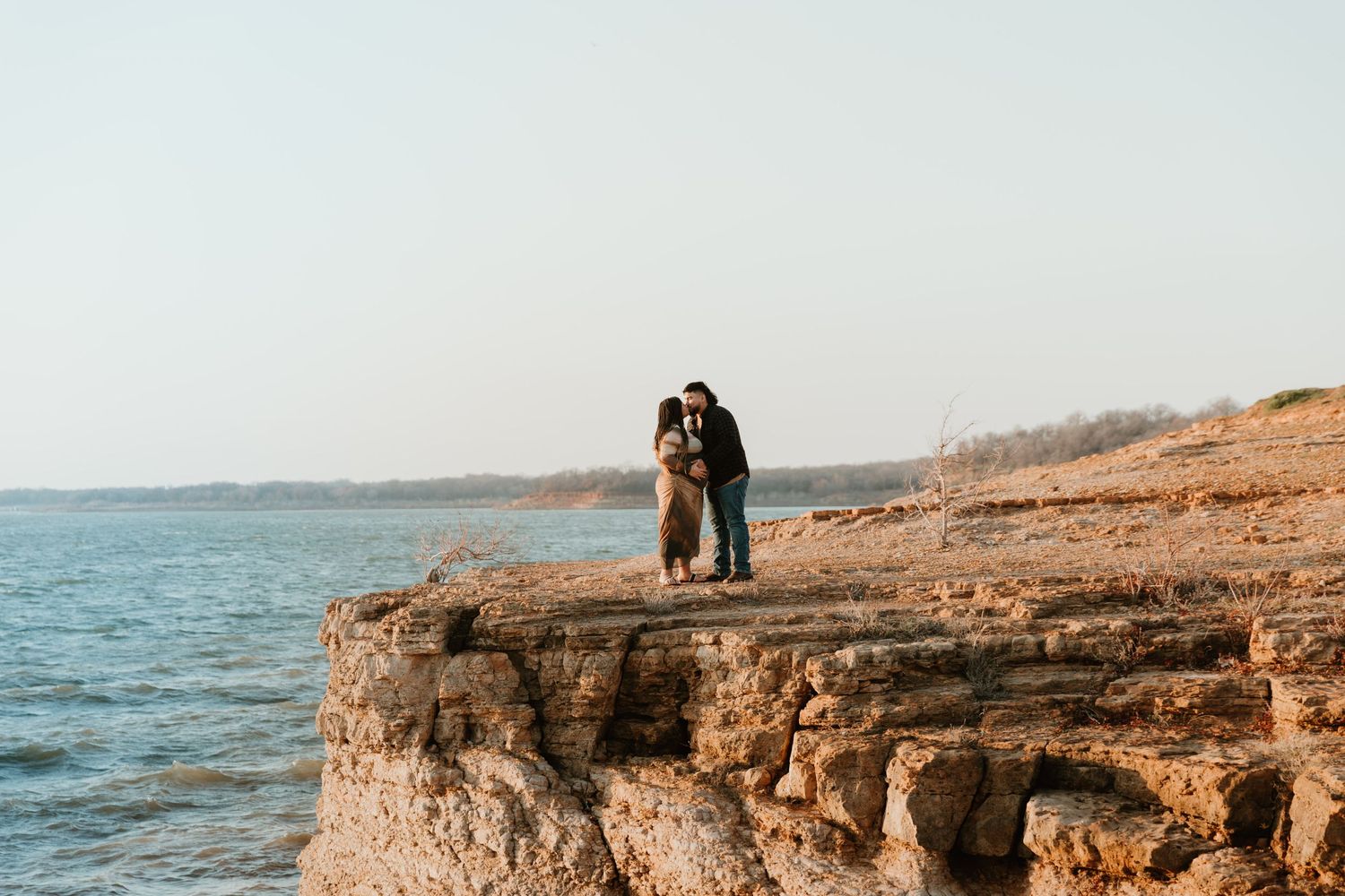 Scenic rocky coastal landscape with ocean views at sunset.