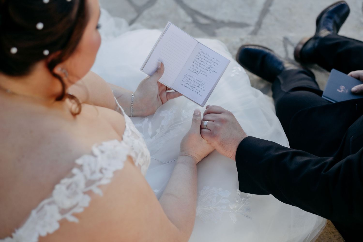 Close-up of wedding vows being read during ceremony.