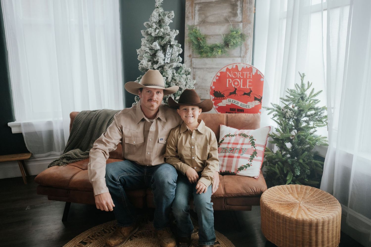 Holiday family photos in front of Christmas tree with rustic farmhouse decor.