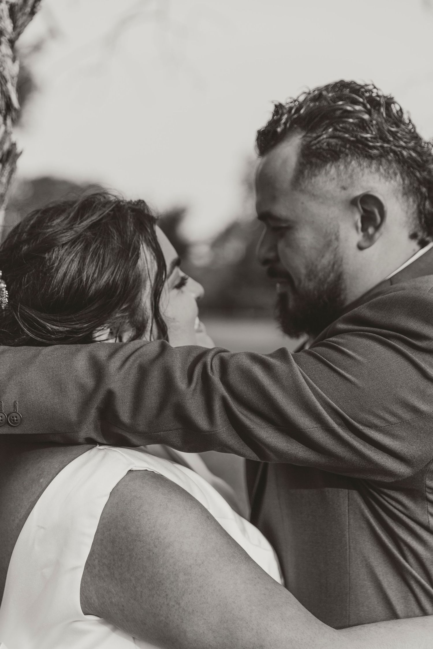 Black and white series showing intimate embraces between a couple.