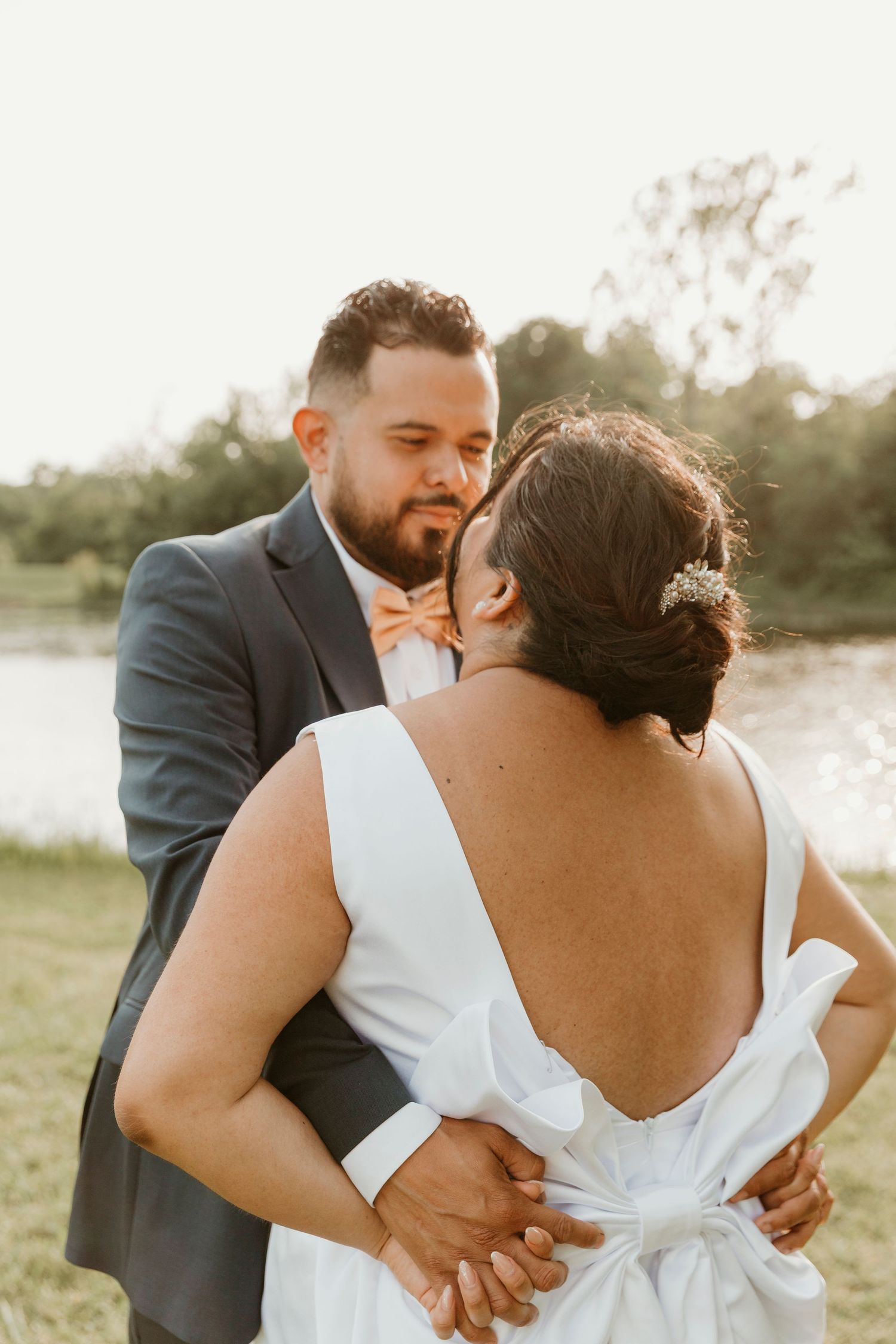 Golden hour photos of a couple sharing playful and romantic moments outdoors.