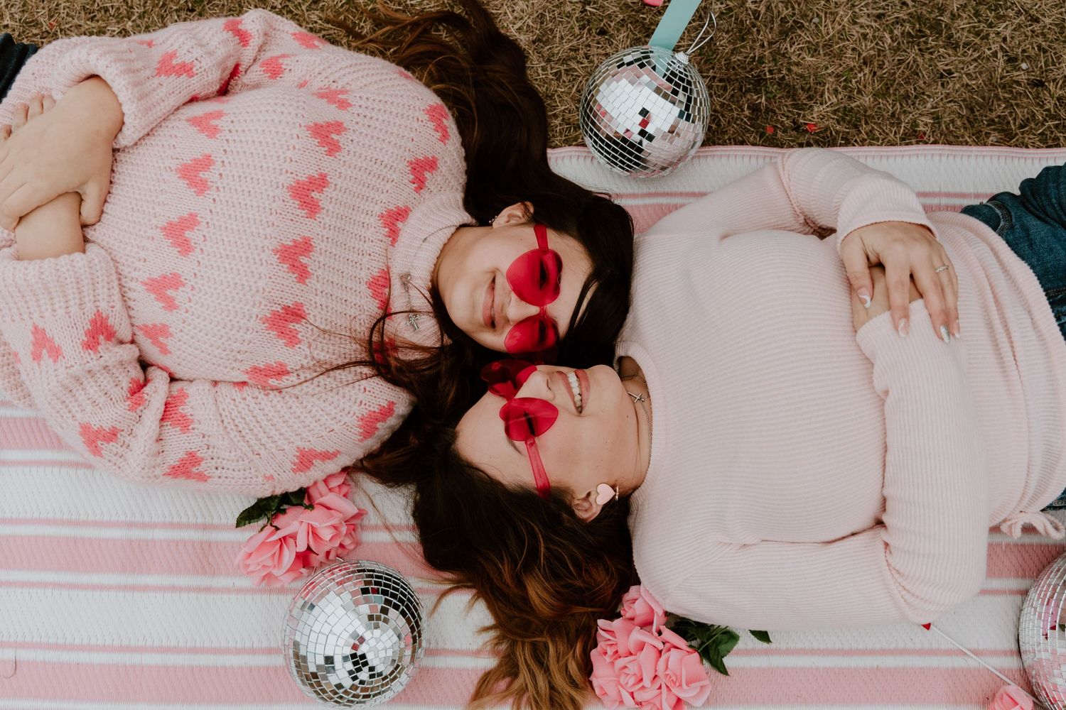 Valentine's themed portrait session with pink decor and disco balls.