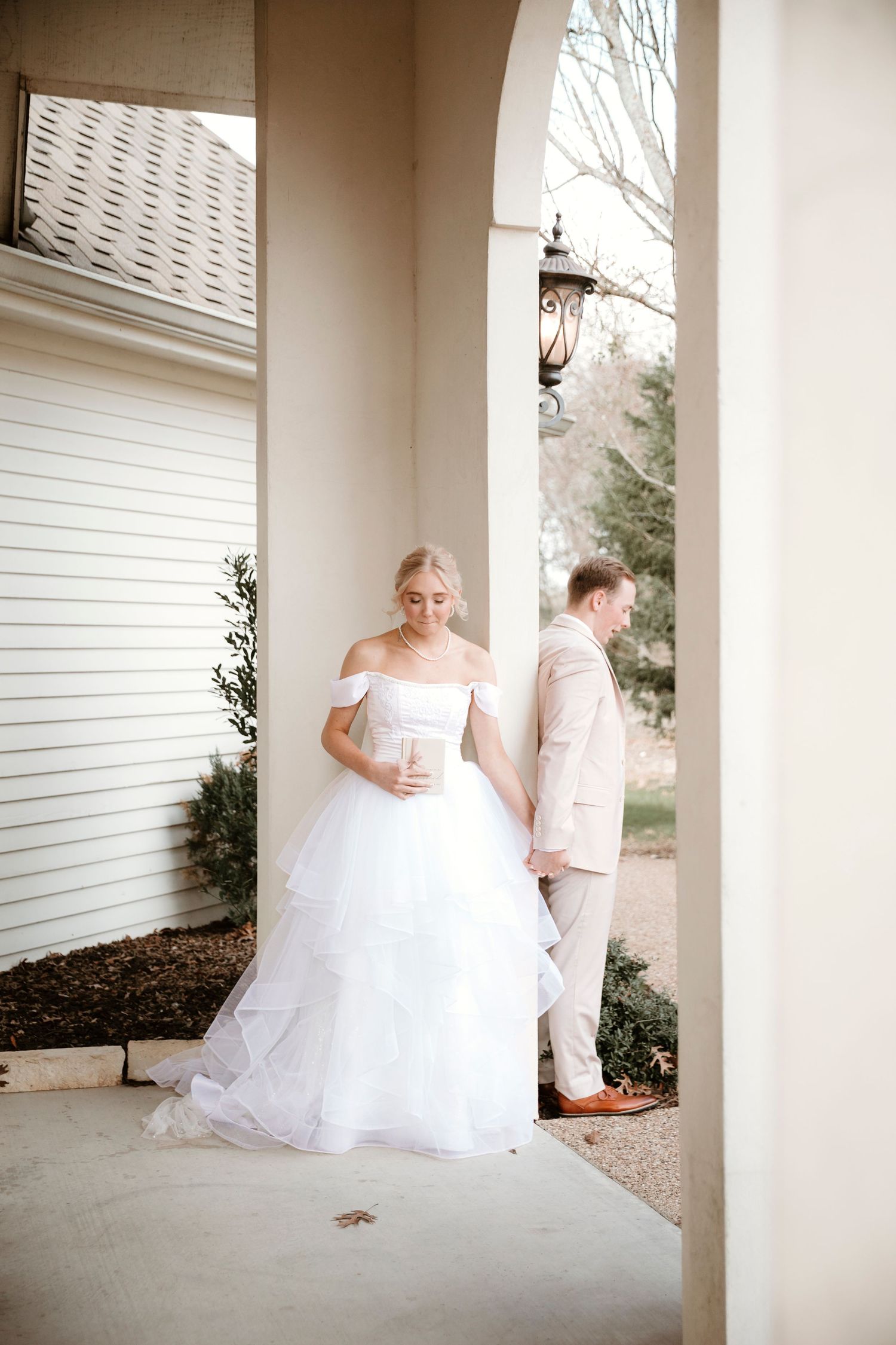 A series of romantic wedding photos showing a couple on a white columned porch in soft, dreamy lighting.