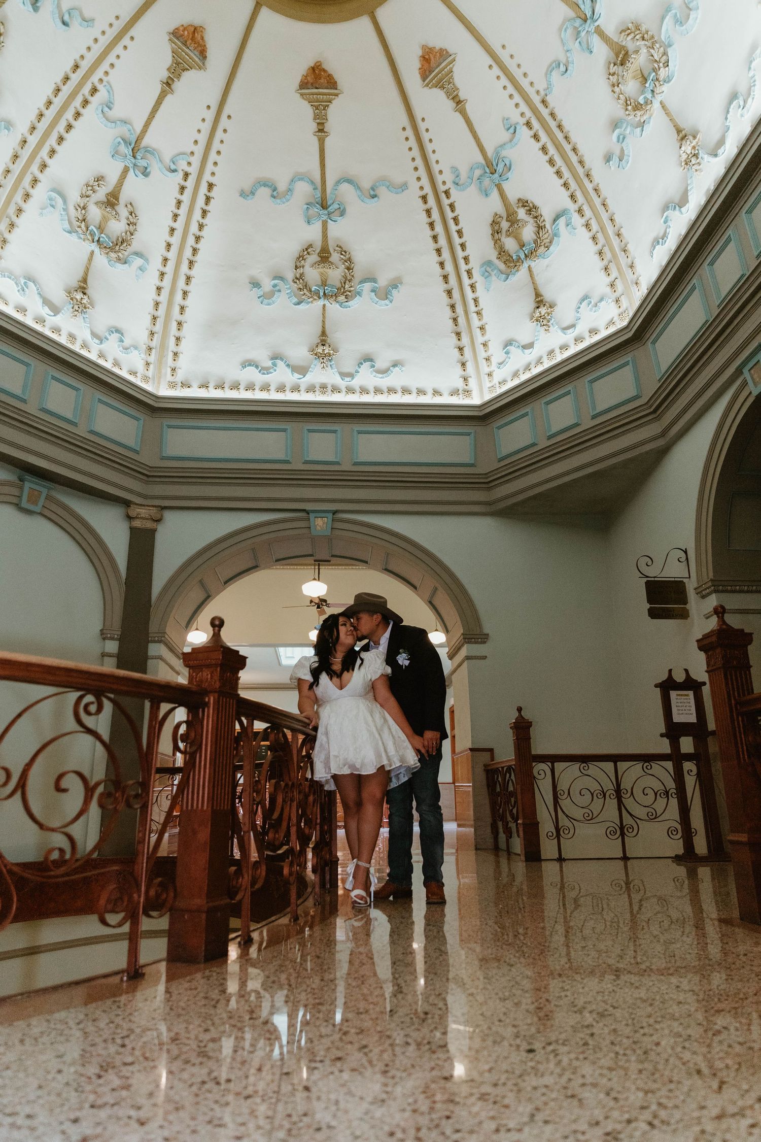 Interior view of an ornate decorative ceiling in a historic building with elegant architectural details.