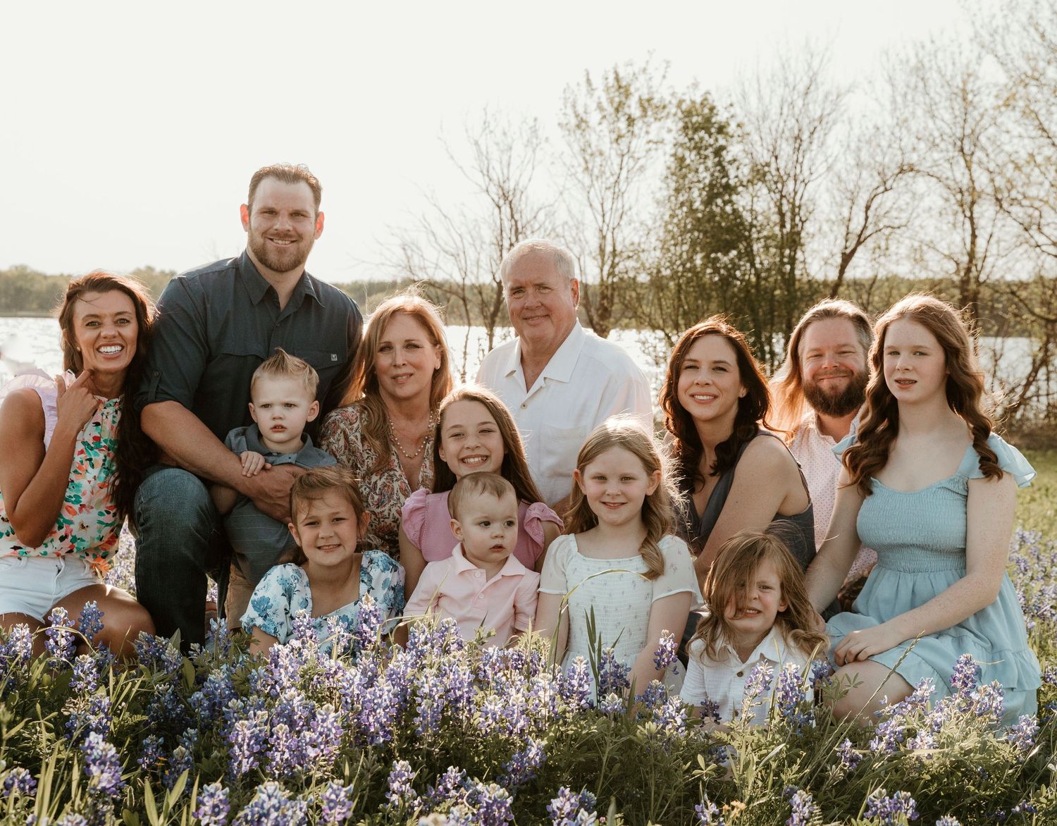 Extended family portrait session in a beautiful field of blooming bluebonnets.