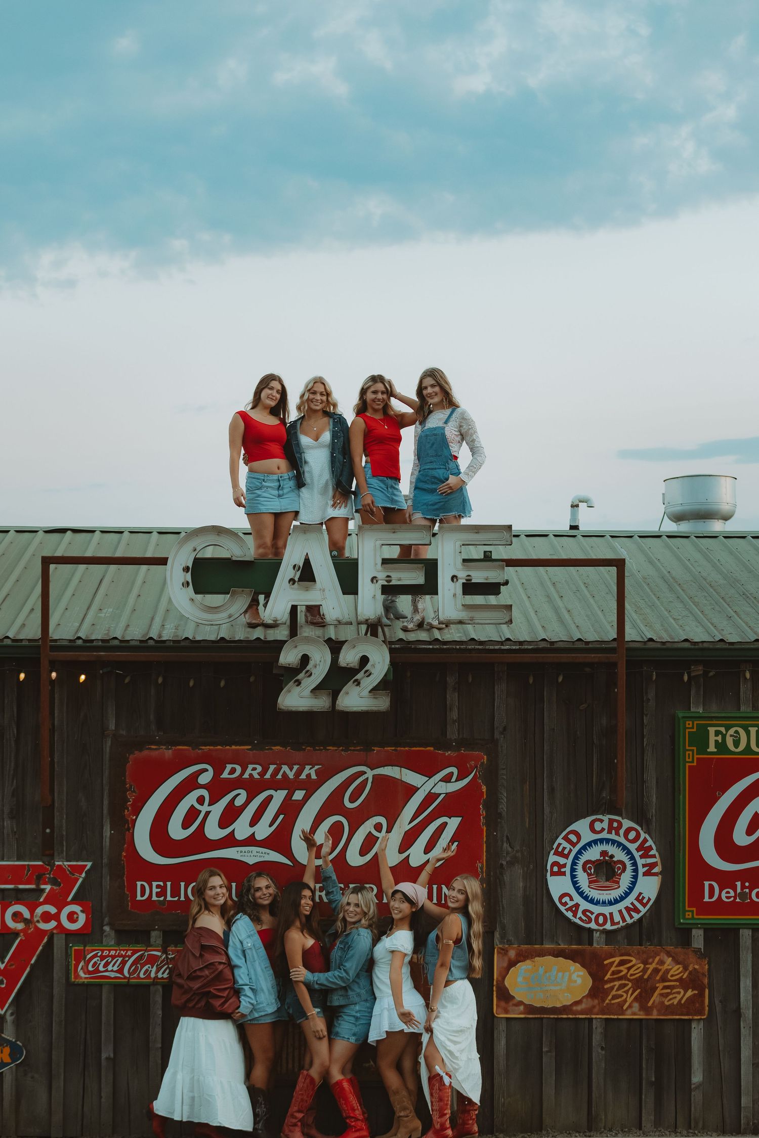 Vintage cafe exterior with classic advertising signs and retro decor.