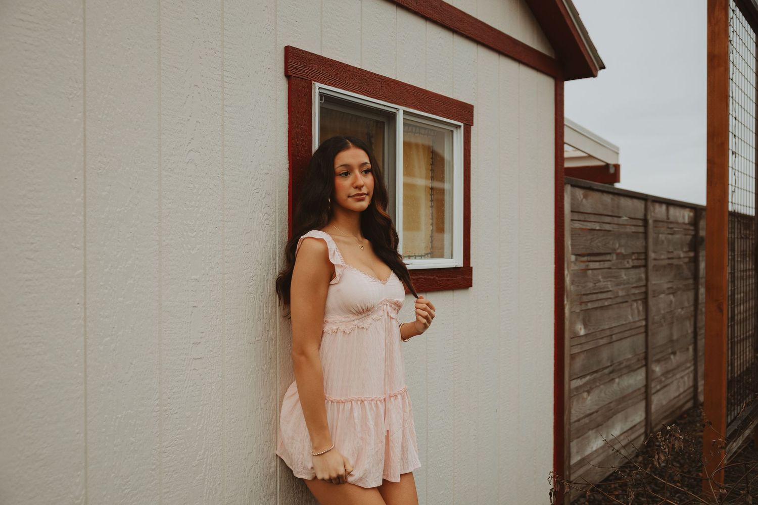 Outdoor fashion photography session showcasing light pink summer outfits.