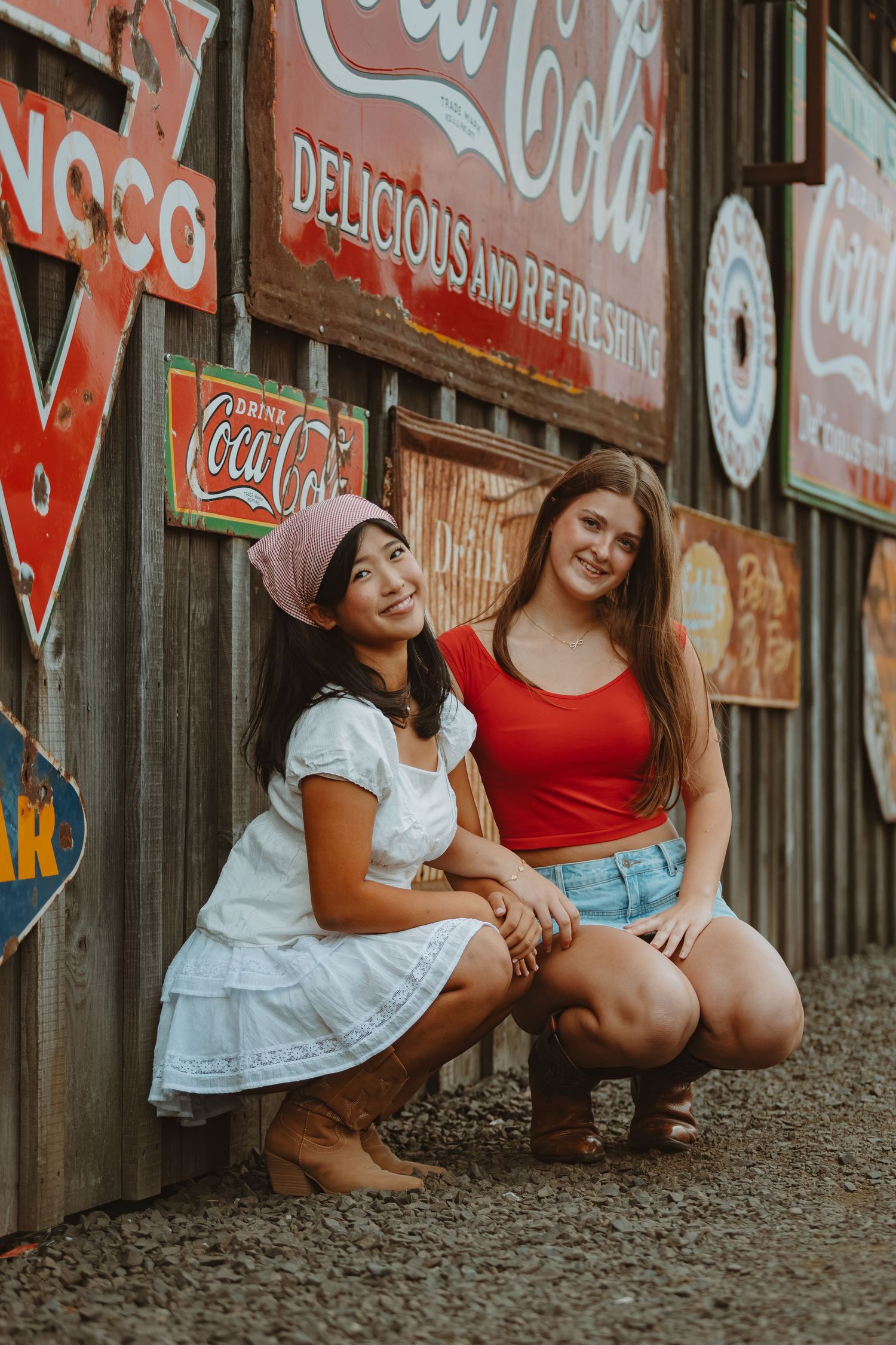 Casual portrait session against a backdrop of classic Coca-Cola signage.