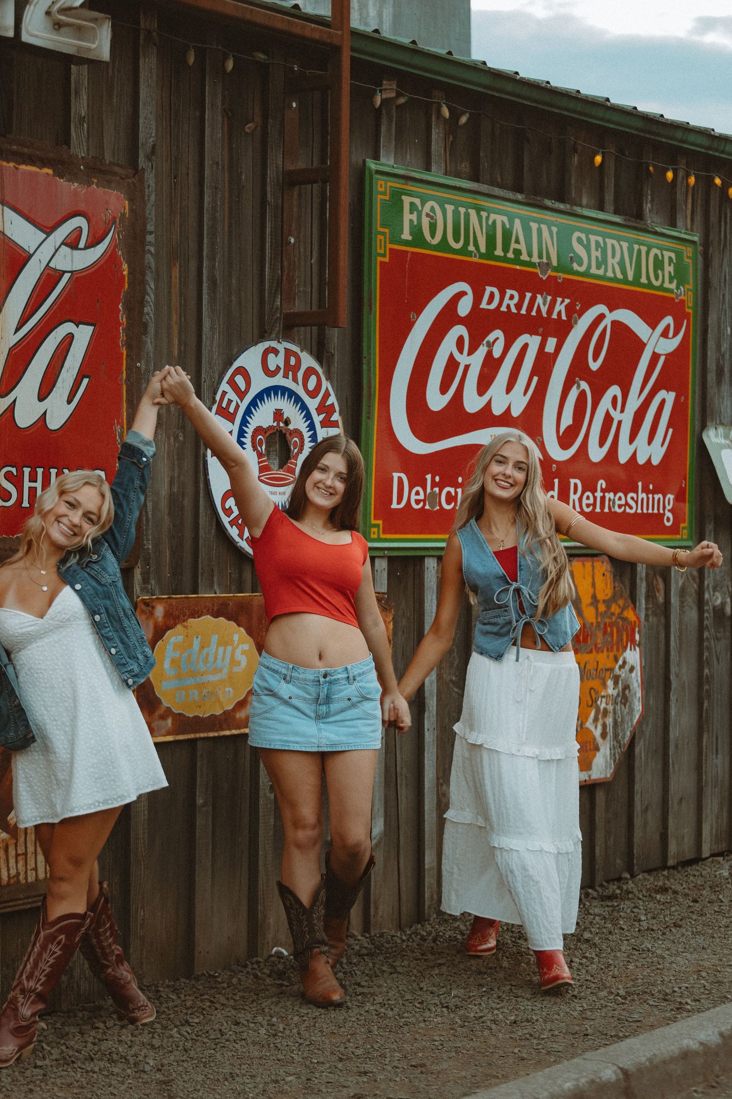 Retro Coca-Cola fountain service signs create nostalgic scene against wooden backdrop.