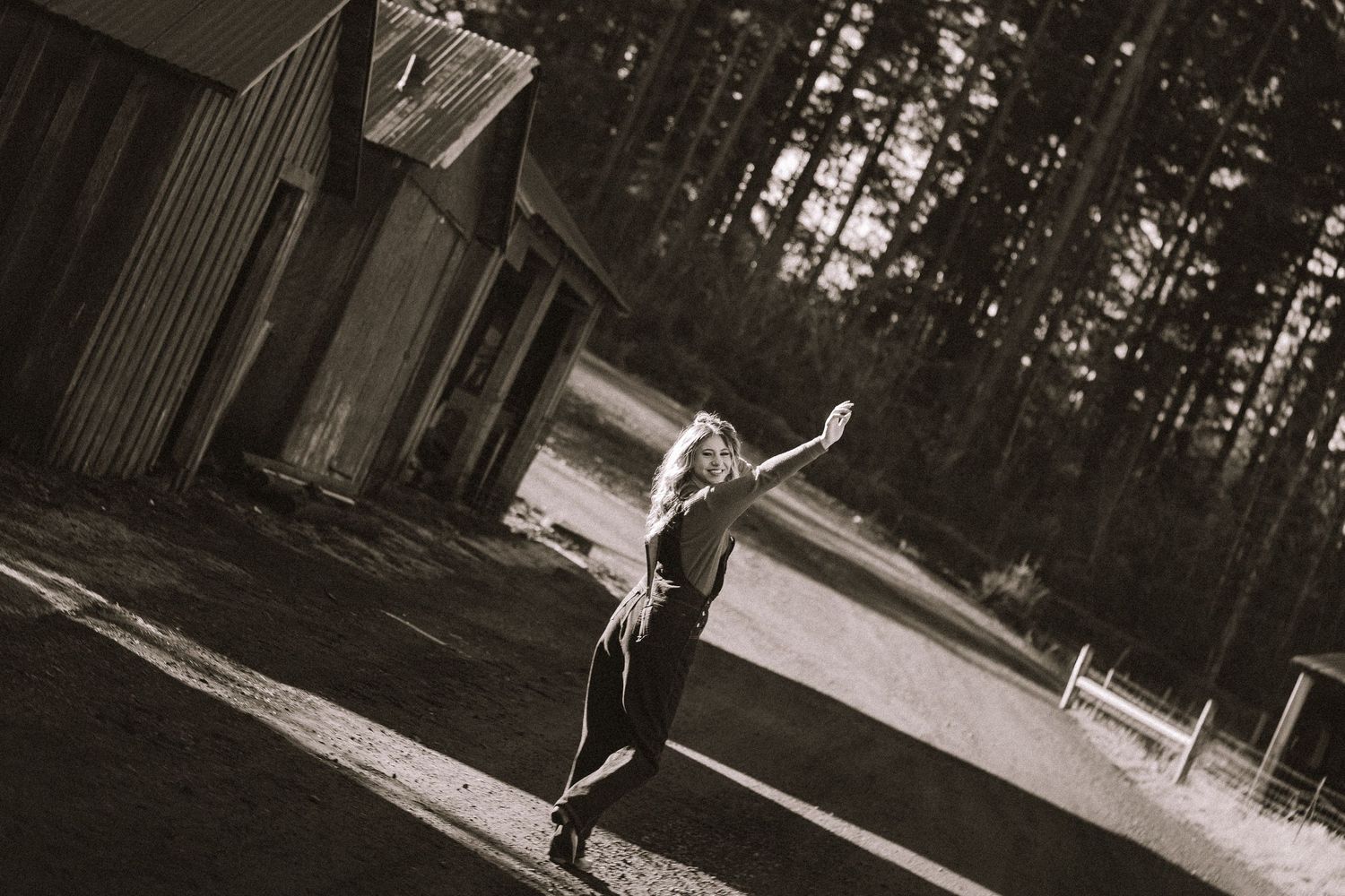 A black and white photo series showing people jumping and posing playfully outdoors.
