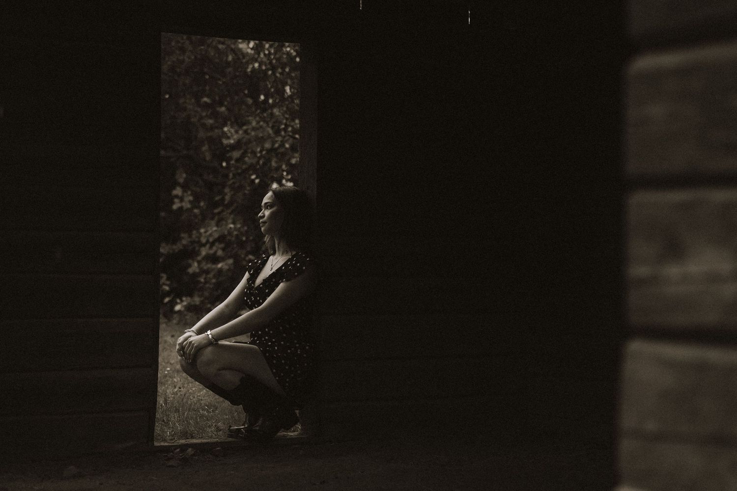 A series of black and white photographs arranged horizontally showing intimate moments in an artistic style.