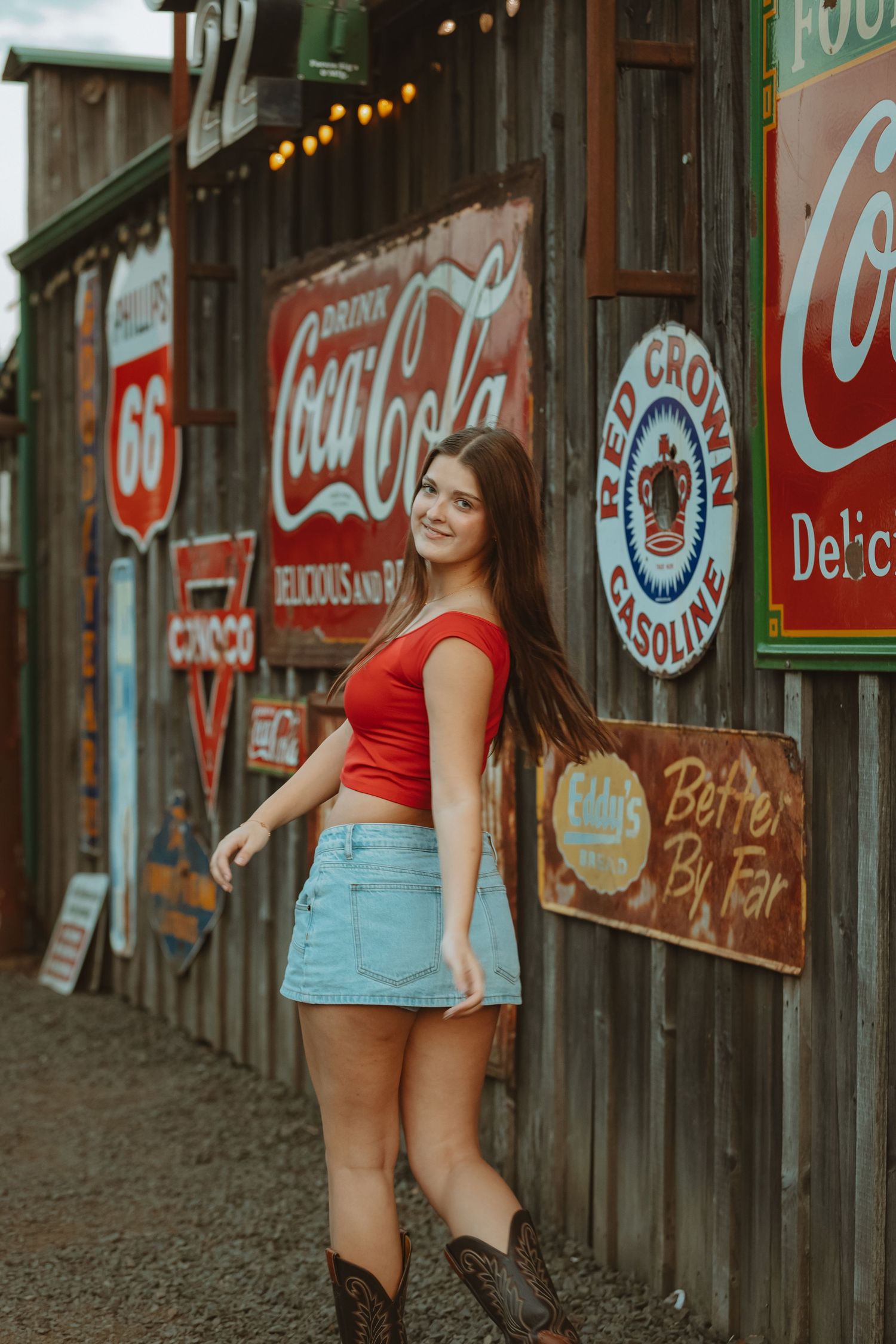 Retro-styled scene with vintage Coca-Cola signage and Route 66 memorabilia.