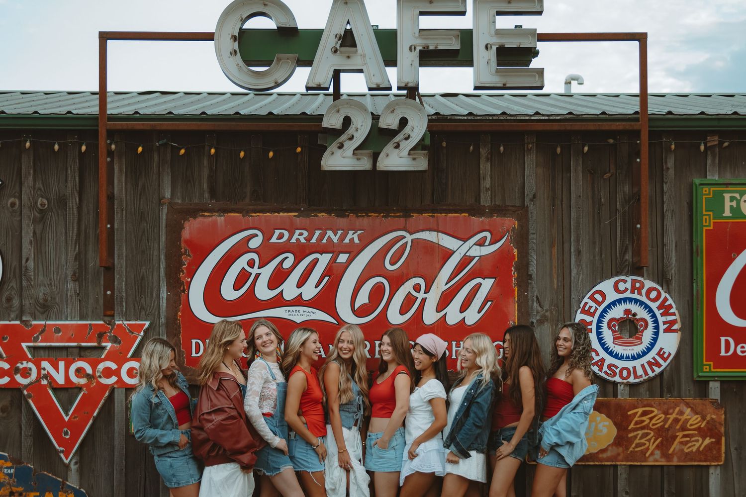 Vintage cafe exterior with classic Americana signage and wooden walls.