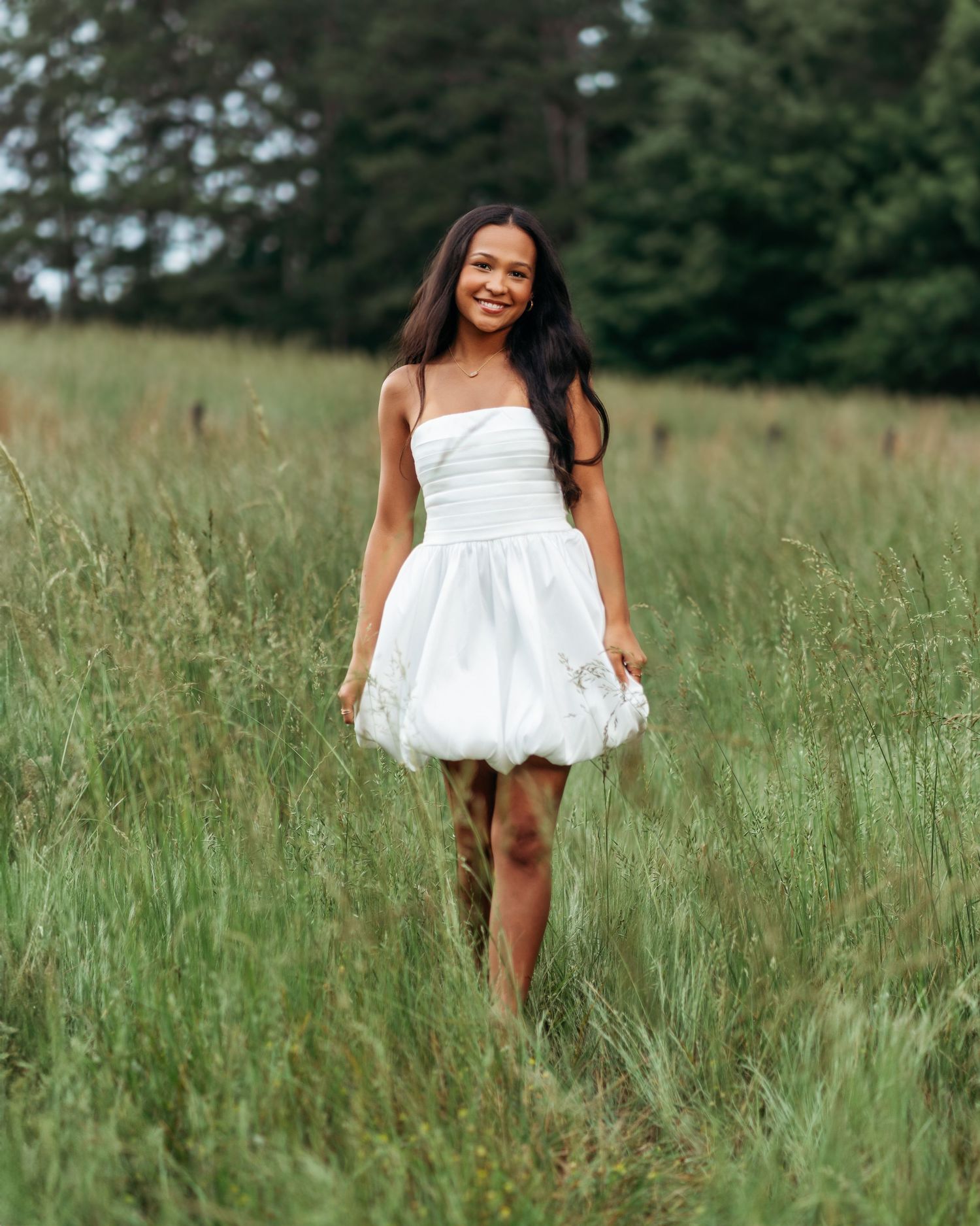 White sundress portrait series in tall summer grass field.