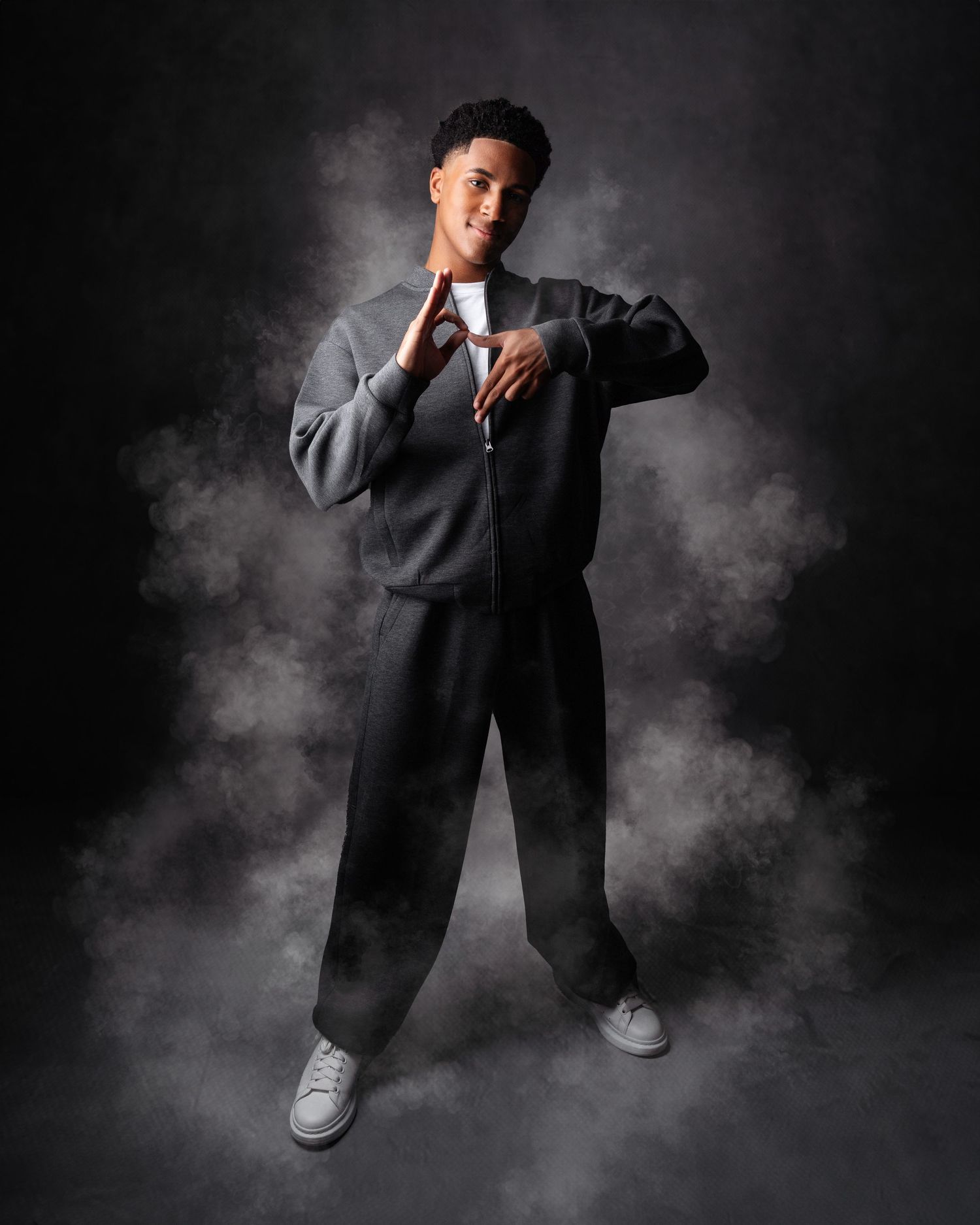 Dramatic black and white portraits with smoke effects and urban styling.