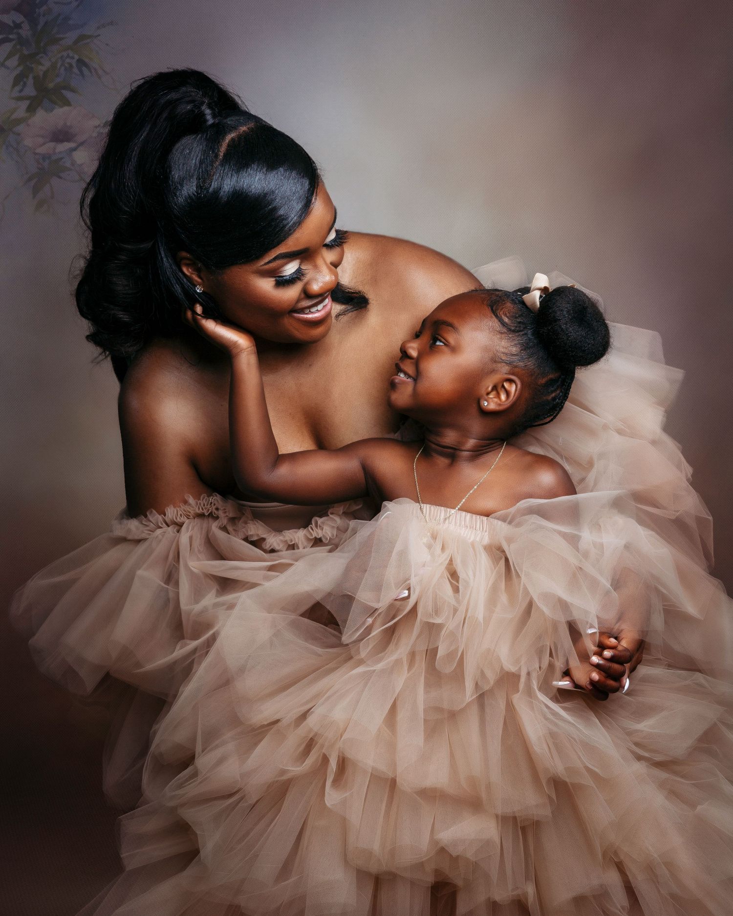 Romantic couple in soft pink tulle dress sharing intimate moments in a series of artistic portrait photos.